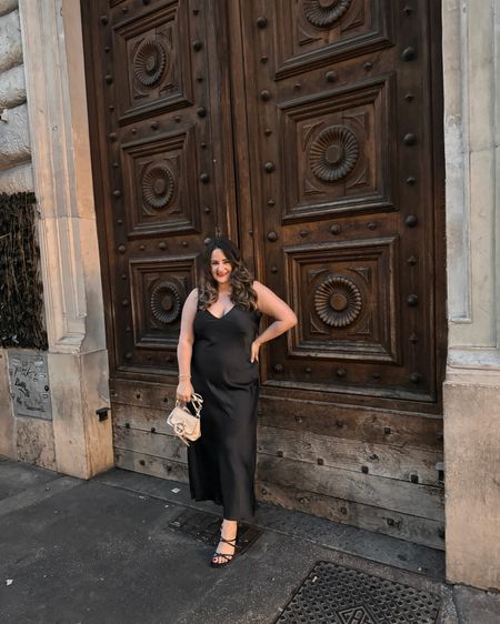 A night out in Rome! Love this gorgeous satin midi that is so perfect for date night. Wearing an xl. Paired with shaping shorts and a black heel plus my new see by Chloe bag!

Midsize 
Curvy
Black dress
Satin dress
Wedding guest dress
Target find 

#LTKmidsize #LTKwedding #LTKparties
