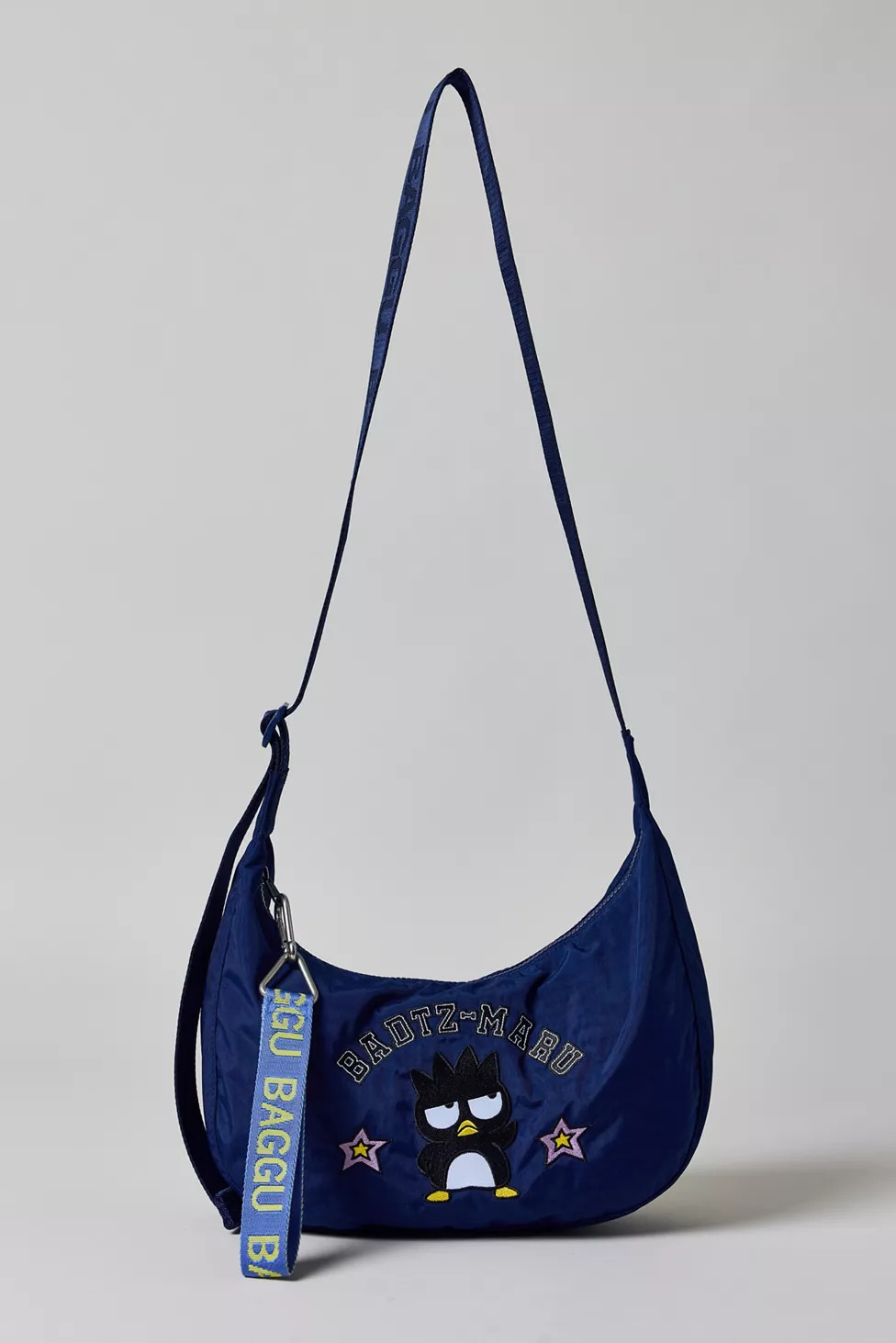 BAGGU X Hello Kitty And Friends UO Exclusive Badtz-Maru Medium Nylon Crescent Bag | Urban Outfitters (US and RoW)