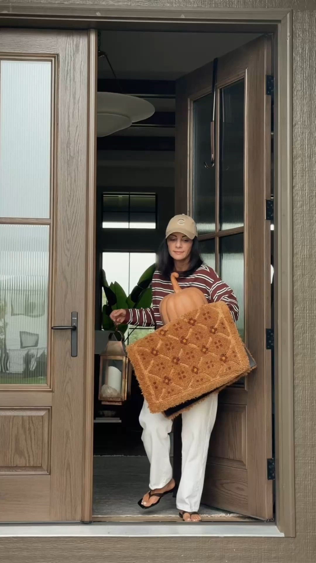 Fall front porch is officially ready 🍂 I layered a washable plaid rug under a classic doormat, then added oversized mums, woven planters, warm-toned pumpkins, lanterns and simple wreaths for a cozy, collected look. I linked everything I could so you can recreate the look! 🤎

#LTKHome #LTKSeasonal #LTKFindsUnder50