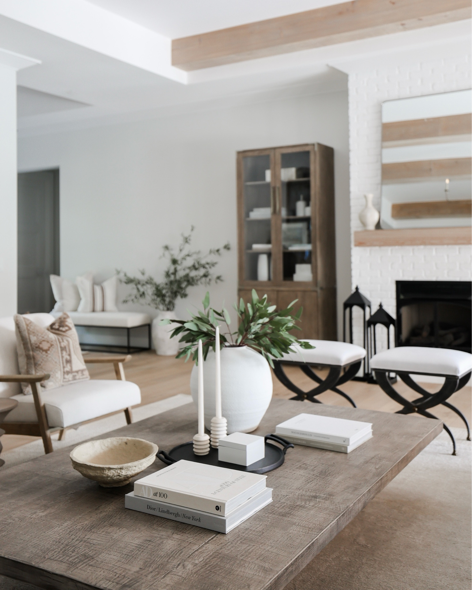 Coffee table styling! Must have books, vase, stems, tray, and candle holders! 
Bowl, pillow, chair, cabinet 

#LTKhome #LTKstyletip