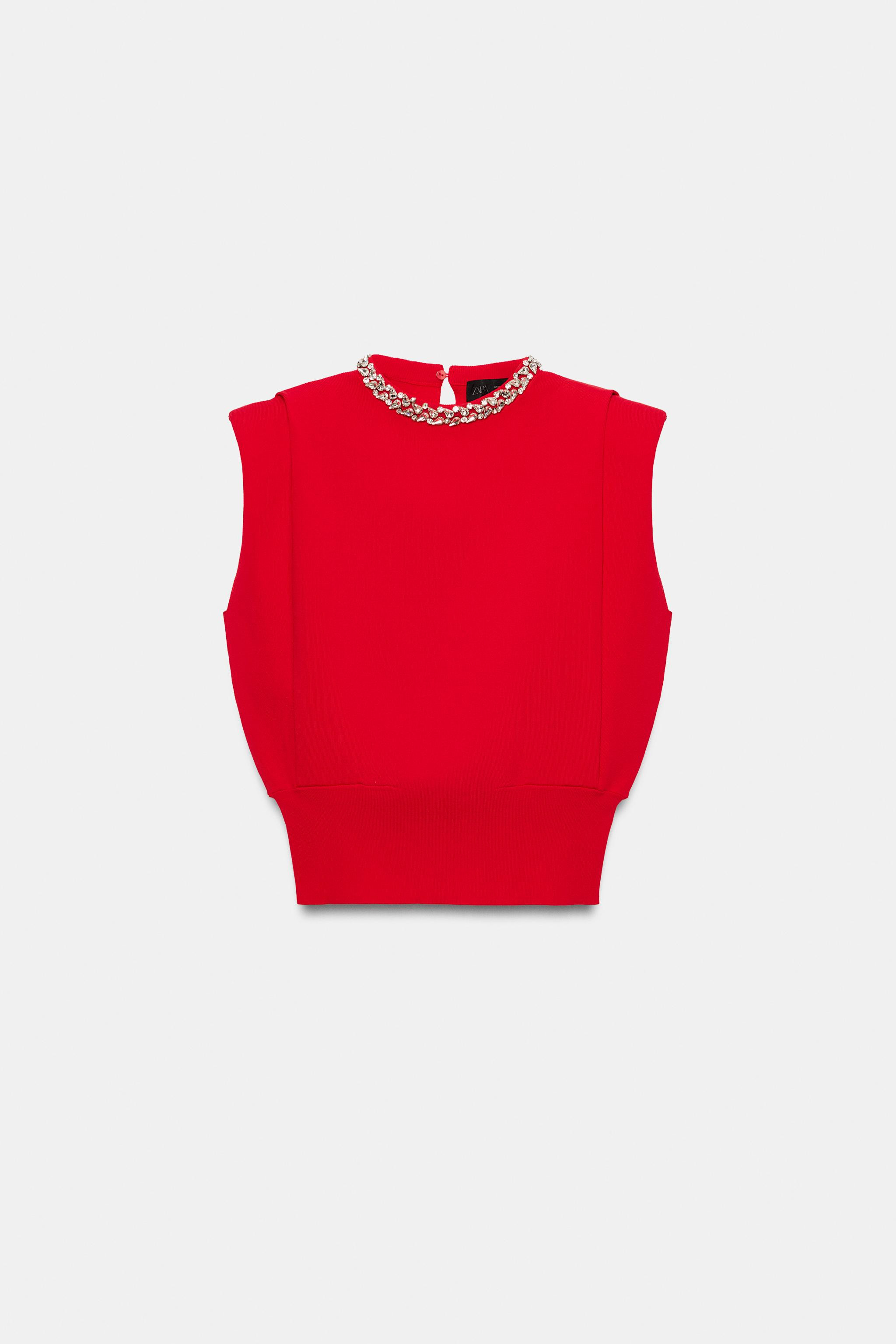 Sleeveless round neck top with shoulder pads. Features jewel appliqu\u00e9 detailing at the neckl... | Zara US