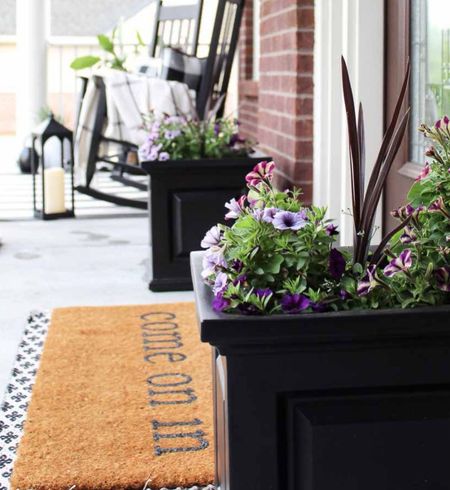 I love these classic black self-watering planters for a covered front porch. Shop this look including my black outdoor rocking chairs and outdoor decor for spring.

#LTKSeasonal #LTKhome #LTKsalealert