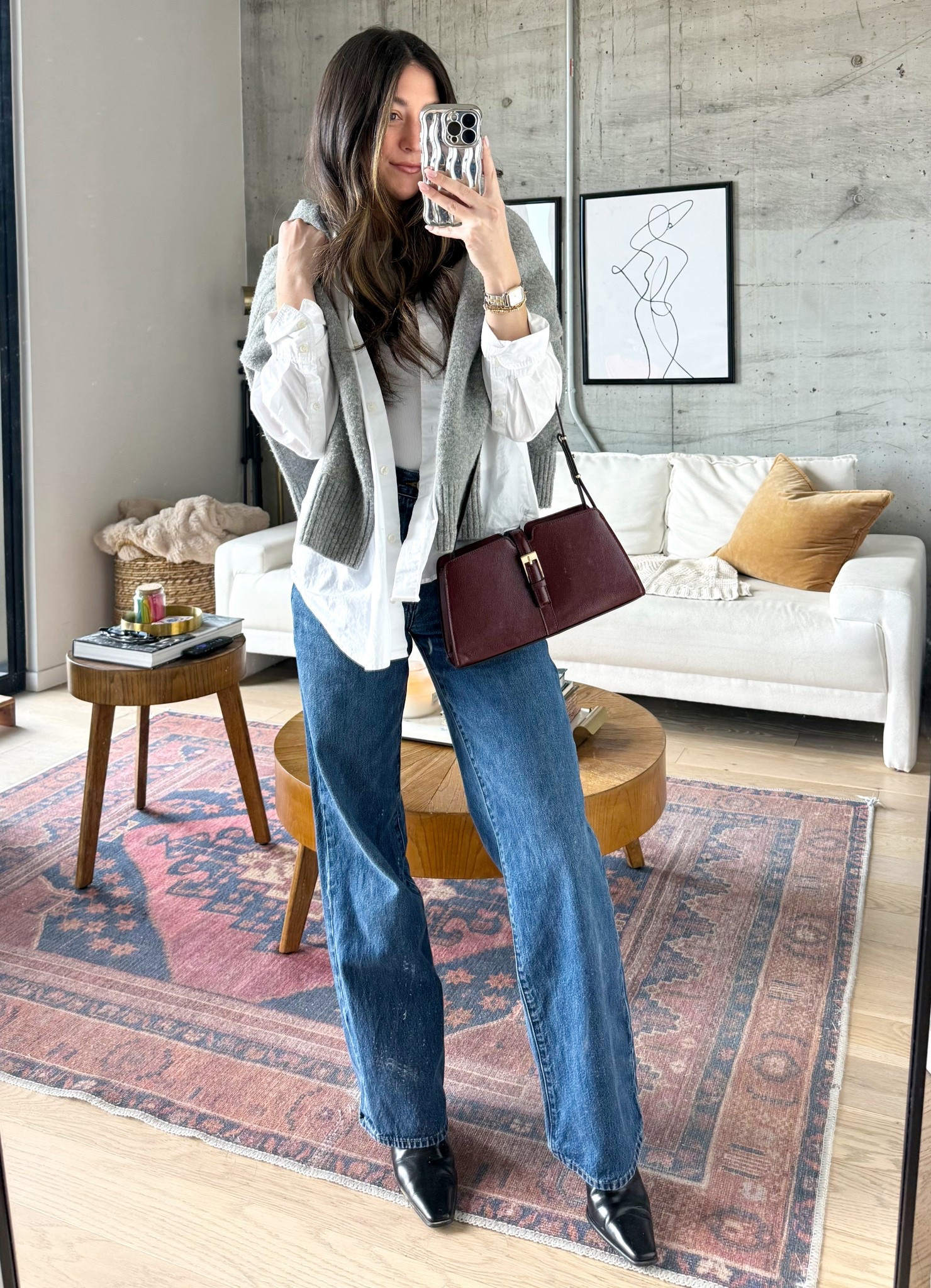 Classic layers done right 🤎 A crisp white button-down styled with a soft gray knit, relaxed denim, and a structured burgundy bag. Effortless, timeless, and easy to wear on repeat.

#LTKBeauty #LTKgrwm #LTKootd
