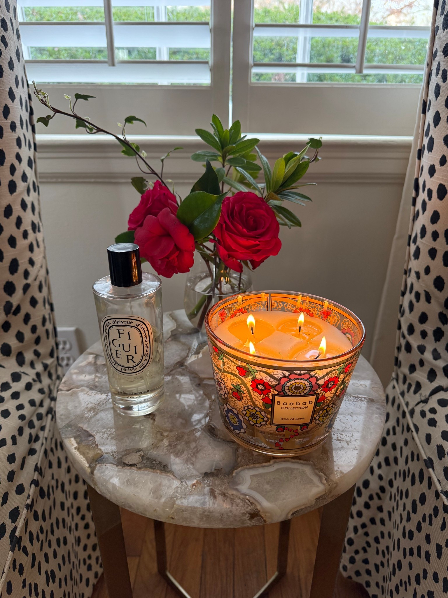A cozy spot in our living room. I love a good candle or room spray. And of course flowers and greenery from our yard are always in the mix…  and I love a stemless wine glass as a petite bouquet vase. 
#lcmlifestyle #candles #fragrance 

#LTKHome #LTKselfcare #LTKdayinmylife