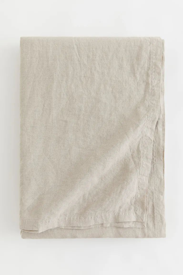 Large tablecloth in washed, woven linen fabric with double-stitched edges. | H&M (US + CA)