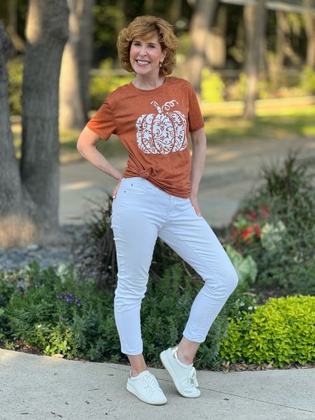 This graphic tee comes in so many fun colors and patterns! I paired mine with my favorite No-Stain (Yes! Really!) white Girlfriend ieans and white platform sneakers since it's still hot in Dallas!

#LTKHalloween #LTKstyletip #LTKSeasonal