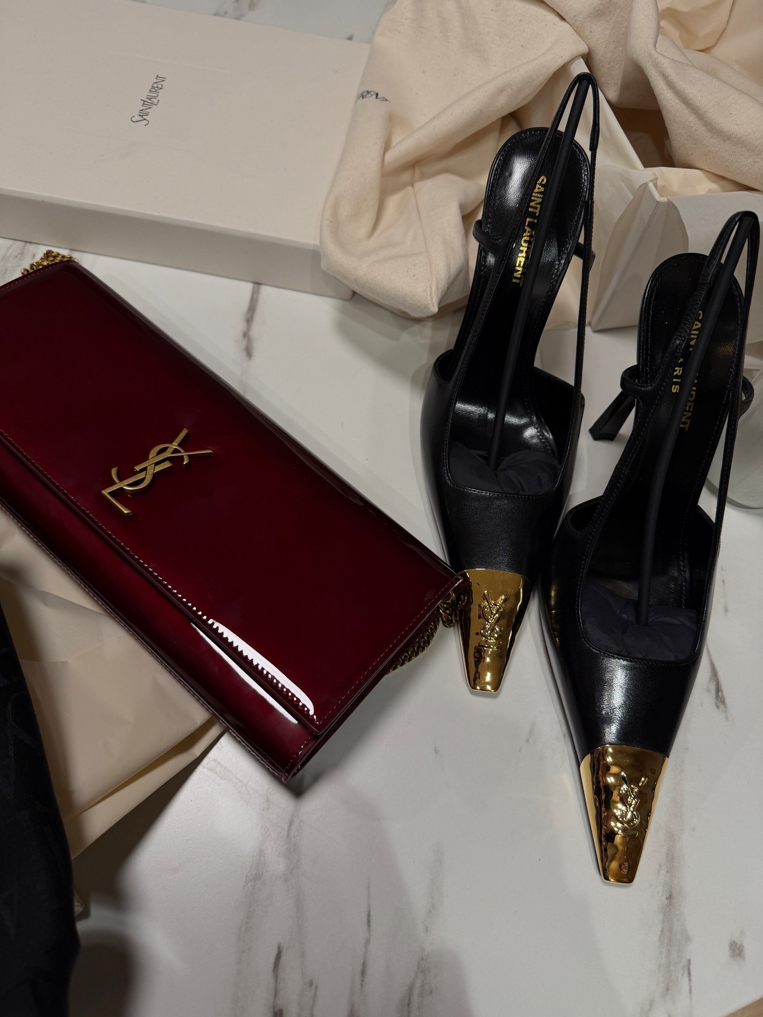 New YSL!! Luxury shopping spree🖤✨🥂🪩 Limited edition & SELLING OUT quickly!✨

These shoes were my dream 🤩 ekkkk!! I’m so obsessed! From the moment they came out I just fell in love and don’t even get me started on my beautiful chic Kate clutch burgundy red handbag✨

Obsessed with these black and gold iconic YSL heels 👠 pumps stilettos with gold tips and my timeless black on black YSL scarf 

Starting 2026 off right ♥️

———————————
#saintlaurent #designershoes #luxuryshopping #ysl #momentsofchic #stilettos #pumps #heels #scarf #black #designer #chic #timeless #fashion #leather


#LTKGiftGuide 

#LTKSeasonal