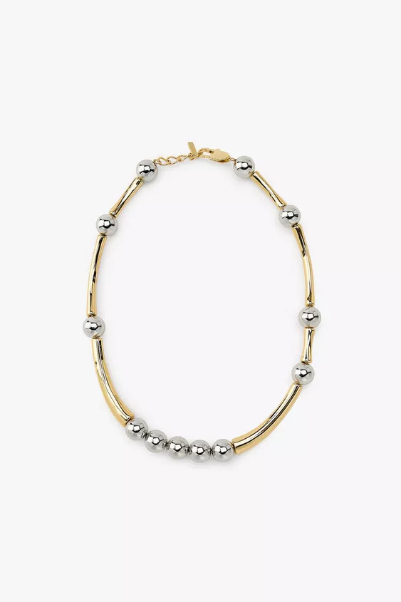 Necklace combining circular metal pieces and elongated tubular pieces. Lobster clasp closure. | Zara US