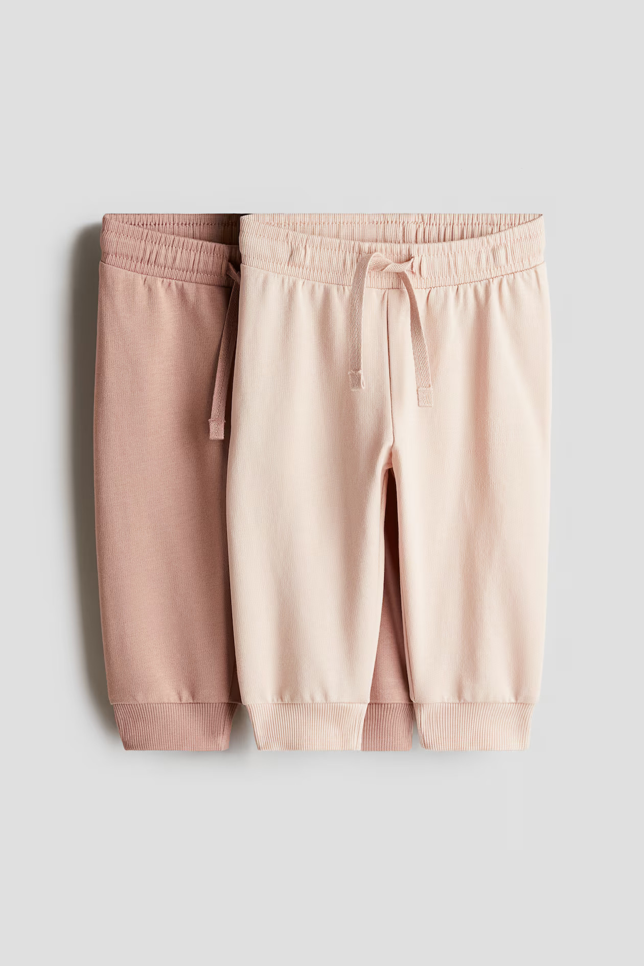 2-pack Joggers - Dusty pink/light pink - Kids | H&M US | H&M (US + CA)