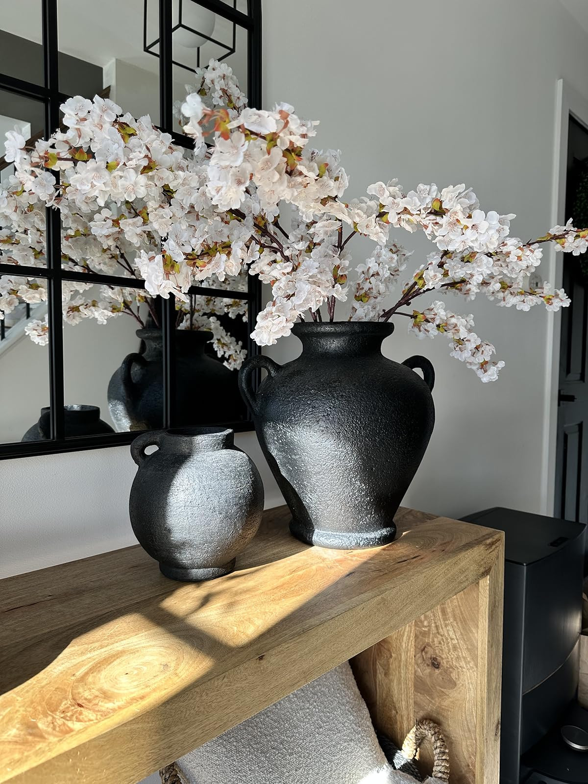Spring Arrangement. Cherry blossom stems. Wood console table. Black pottery vase | Amazon (US)