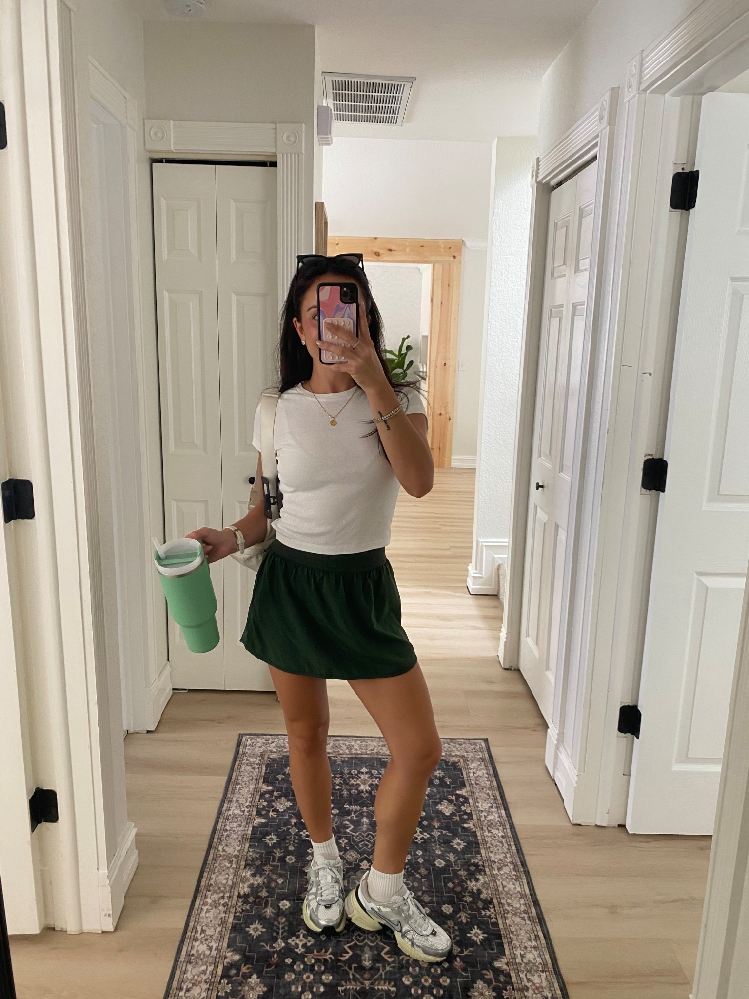 Casual Sunday outfit! Athletic skort from Ptula, white ribbed tee, Nike sneakers. Fall outfit inspo, casual style, travel outfit, airport style, errands ootd, athletic style 

#LTKFindsUnder50 #LTKStyleTip #LTKFindsUnder100