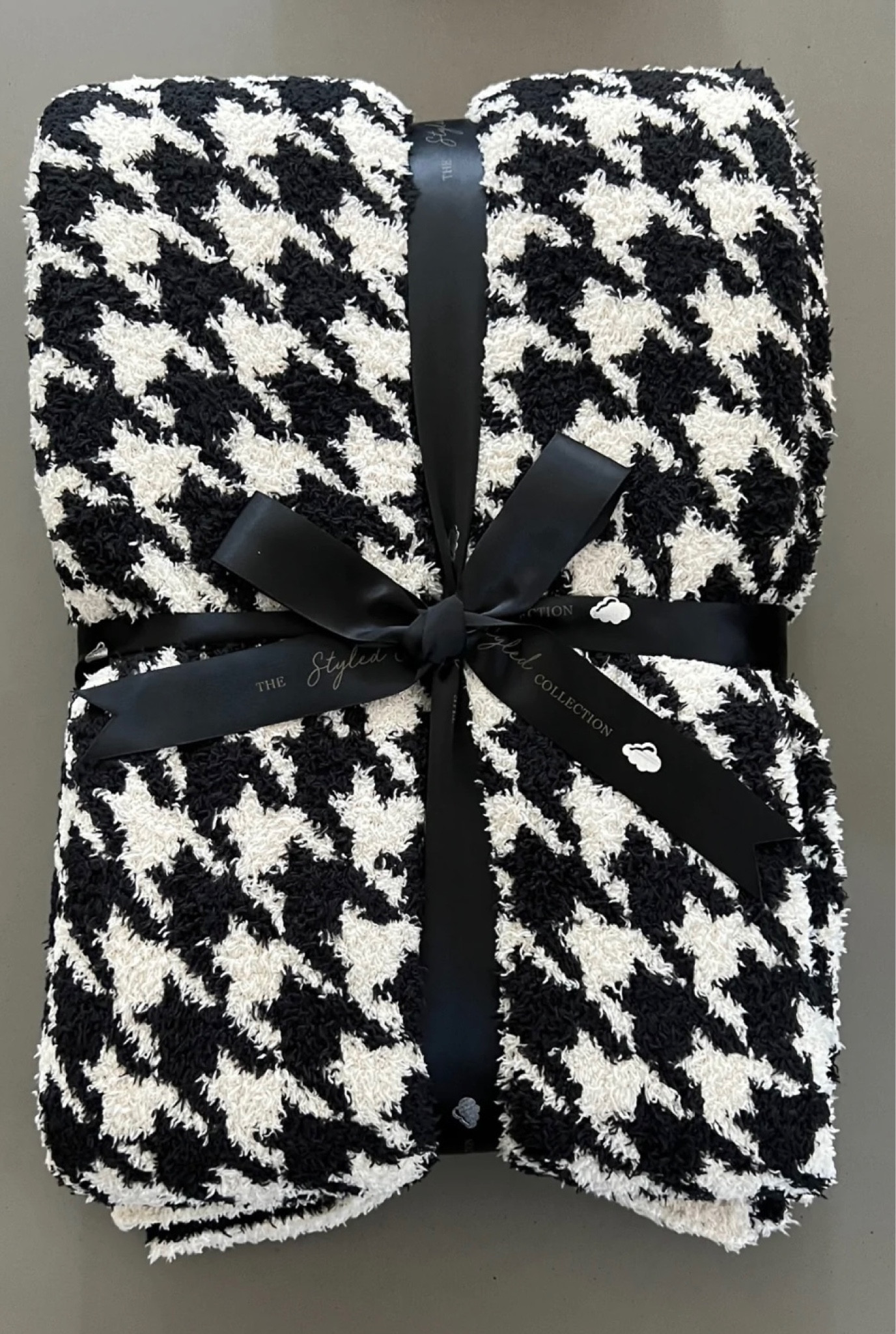 The styled collection houndstooth blanket 

#LTKSale #LTKunder100 #LTKsalealert
