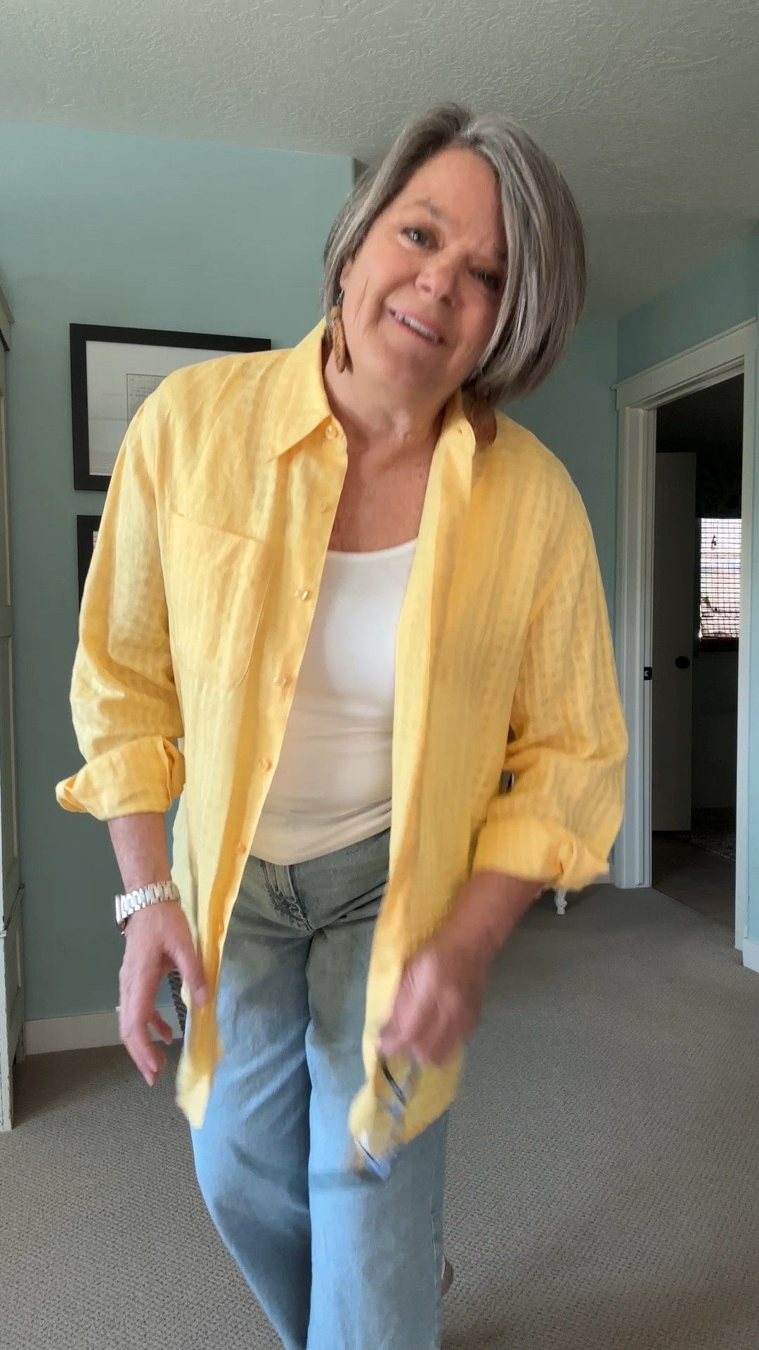 Light blue jeans with a cuff that are so cute and the fir is fabulous! These jeans are perfect for us ladies over 50. I am wearing a white tank top and a thrifted yellow linen shirt. Casual and comfirtable.

#LTKootd #LTKOver40