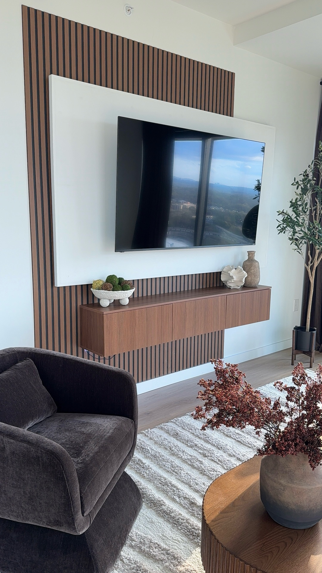 This floating TV setup completely changed the energy in my living room. Clean, modern, and intentional ✨exactly the feeling I wanted when I come home and unwind.

Styled the floating stand with a few simple decor pieces to keep the focus on the wall design while still making the space feel warm and lived in.

Small details really do make a space feel like home.

#LTKvlog #LTKdayinmylife #LTKHome