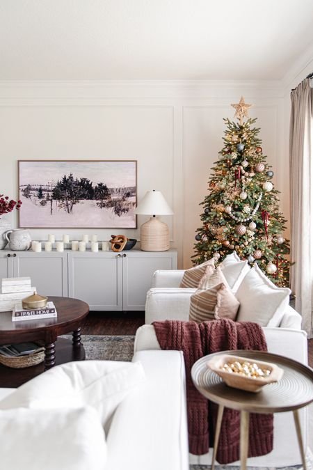 Winter frame tv art, 2022 samsung frame tv, cozy christmas living room design, traditional christmas tree decor, flameless candles, led candles, round wood coffee table, berea chair, living room furniture

#LTKstyletip #LTKHoliday #LTKhome