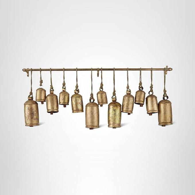 Deco 79 Metal Decorative Cow Bells Tibetan Inspired with 12 Bells on Jute Hanging Ropes and Rod, ... | Amazon (US)