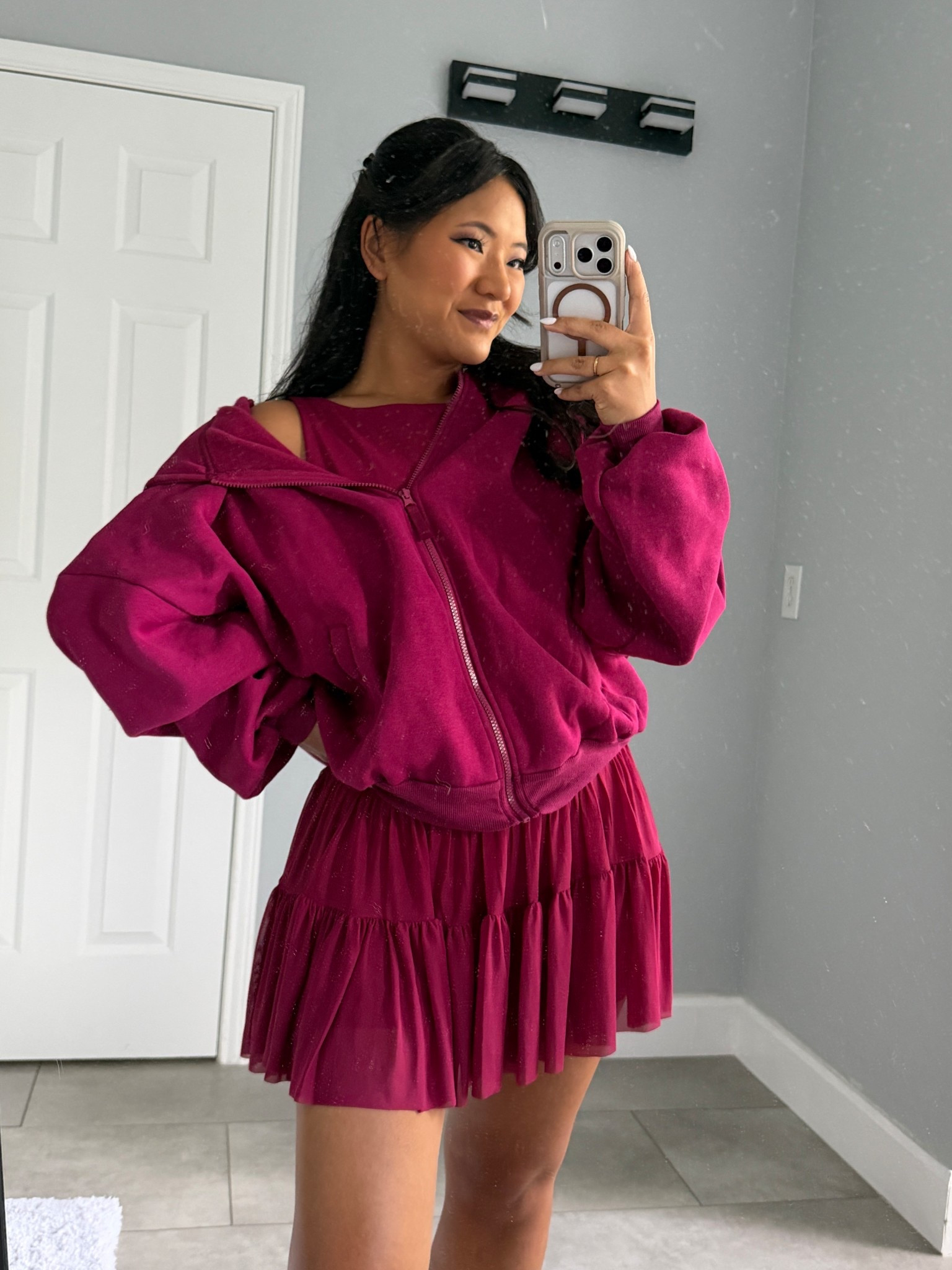 Blogilates Women's Ballerina Skort wearing size medium. Blogilates Women's Boatneck Crisscross Tank Top wearing size large. Blogilates Women's Marshmallow Full Zip Hooded Sweatshirt wearing size medium. 