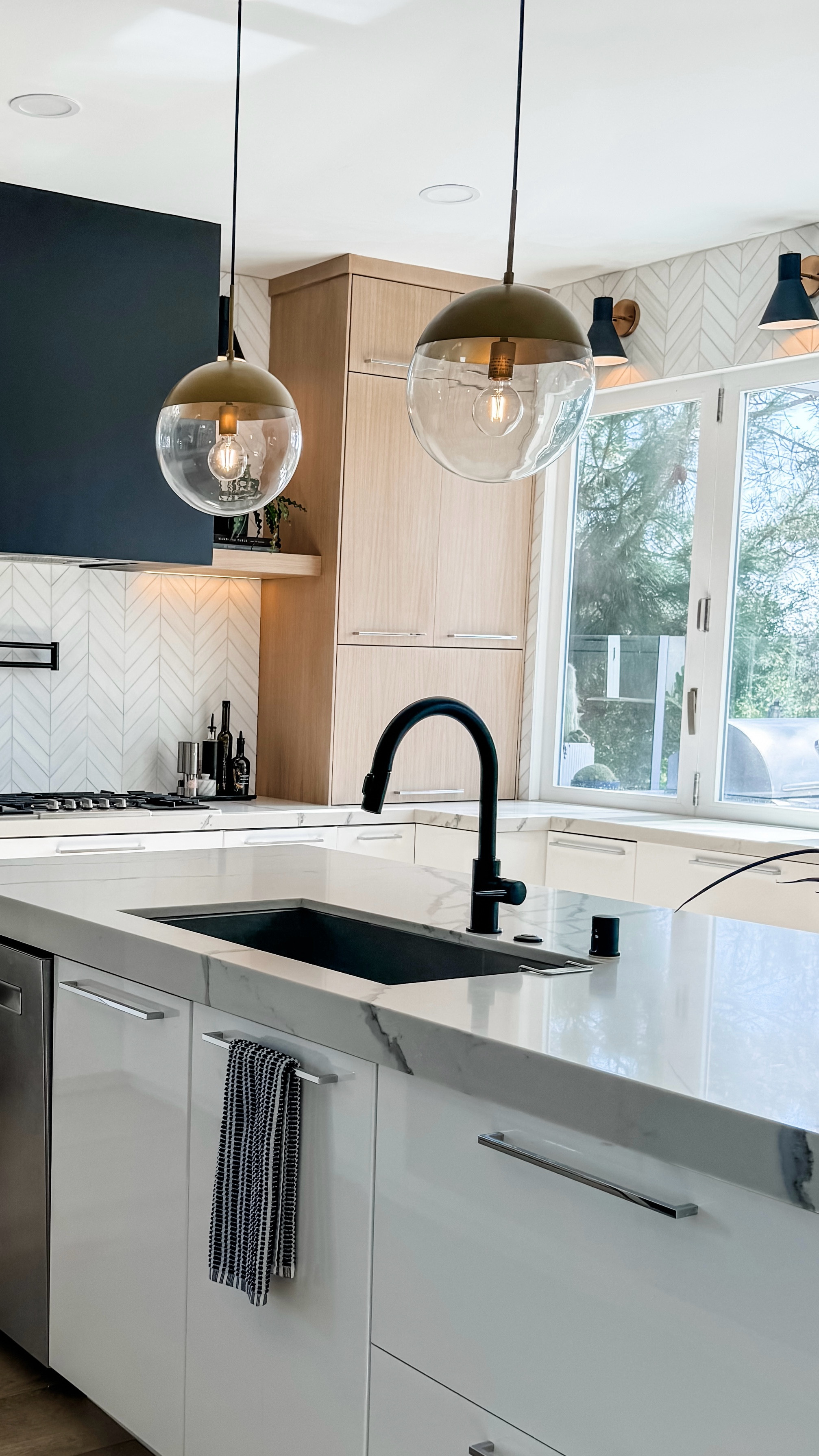 We completely remodeled our kitchen about 10 years ago and it was still beautiful, but as a designer, I needed a change. All we did was reconfigure the hood and upper cabinets, change out the backsplash, add a pot filler and some new lighting. It feels like a brand new kitchen! I linked all my kitchen details here. If you have any questions on specific items, I’ll be happy to answer!

#LTKHome