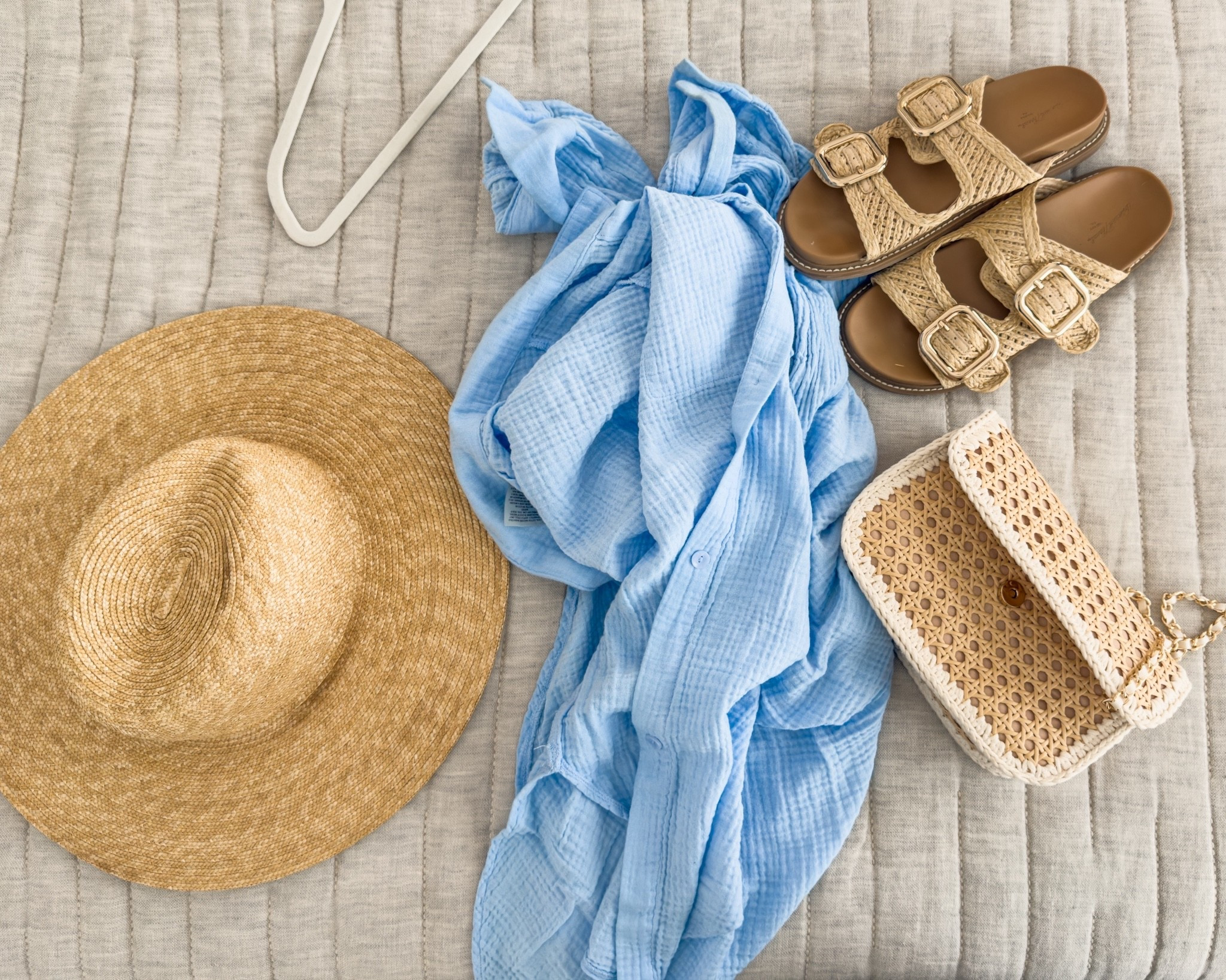 Beach day essentials, but make it cute 🌊☀️

Lightweight layers, easy slides, and all the woven textures… this is my grab-and-go setup for a day by the water 🤍 The gauze button-up is perfect as a coverup, and these sandals are comfy enough for all the back-and-forth from sand to snack runs 🙌🏼

Just add sunscreen + snacks and we’re set 🏖️✨

#LTKstyle #LTKsummer #beachday #momstyle #coastalliving