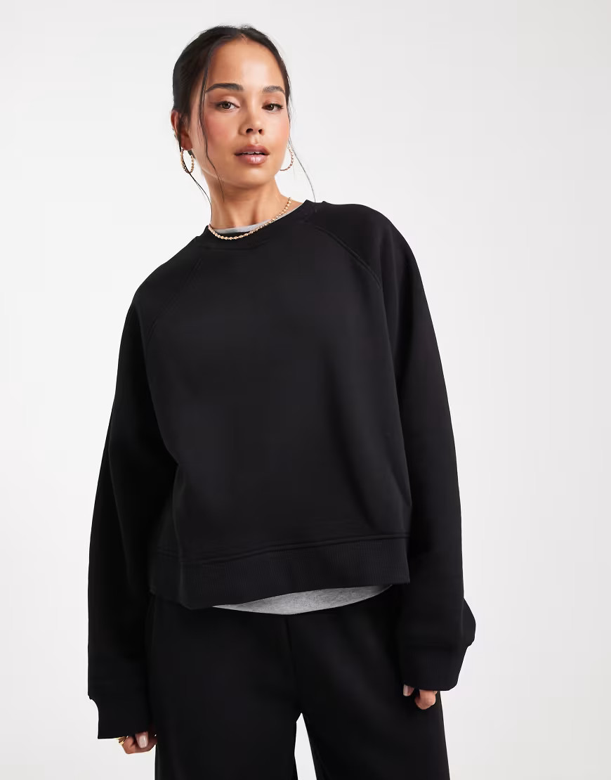 ASOS DESIGN oversized brushback sweatshirt with raglan detail in black | ASOS (Global)