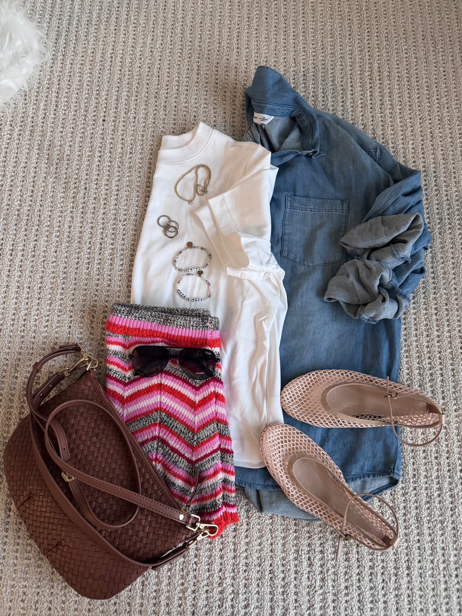 Easy casual spring outfit idea featuring a classic white tee layered with a lightweight denim shirt, colorful zig zag knit sweater, neutral mesh flats, and a woven crossbody bag. This comfortable everyday outfit is perfect for travel days, running errands, or casual weekend plans. It’s a great spring break outfit, resort outfit, spring outfit. These versatile pieces mix high and low price points and can be worn multiple ways throughout spring and early summer. Tap to shop the full outfit including affordable fashion finds, woven bag, mesh flats, and everyday accessories. Follow me on LTK for daily fashion, home decor & Amazon finds.

#LTKTravel #LTKPetite #LTKSaleAlert