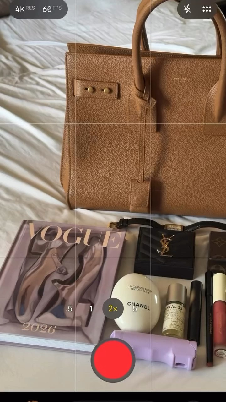 Hi Vogue, this is Juliann Marie, and this is what’s inside my Vivrelle Saint Laurent Sac de Jour. 🤎

A little fashion, a little beauty, a little organization — and pepper spray, because polished and prepared can coexist.

Inside: my Vogue 2026 diary, Chanel hand cream, YSL powder, Louis Vuitton wallet, Le Labo Santal 33, a classic watch, Victoria Beckham lip liner, lipstick and gloss, Makeup by Josie gloss, and my Sundays in Paris purse hook.

And technically, this bag is on loan from @vivrelle, which means I get to rotate designer bags without buying every single one.

Use code JULIANNBROWN for your first month free with Vivrelle.

What’s the one thing you never leave home without?

#WhatsInMyBag #Vivrelle #SaintLaurent #LuxuryDetails #BagEssentials