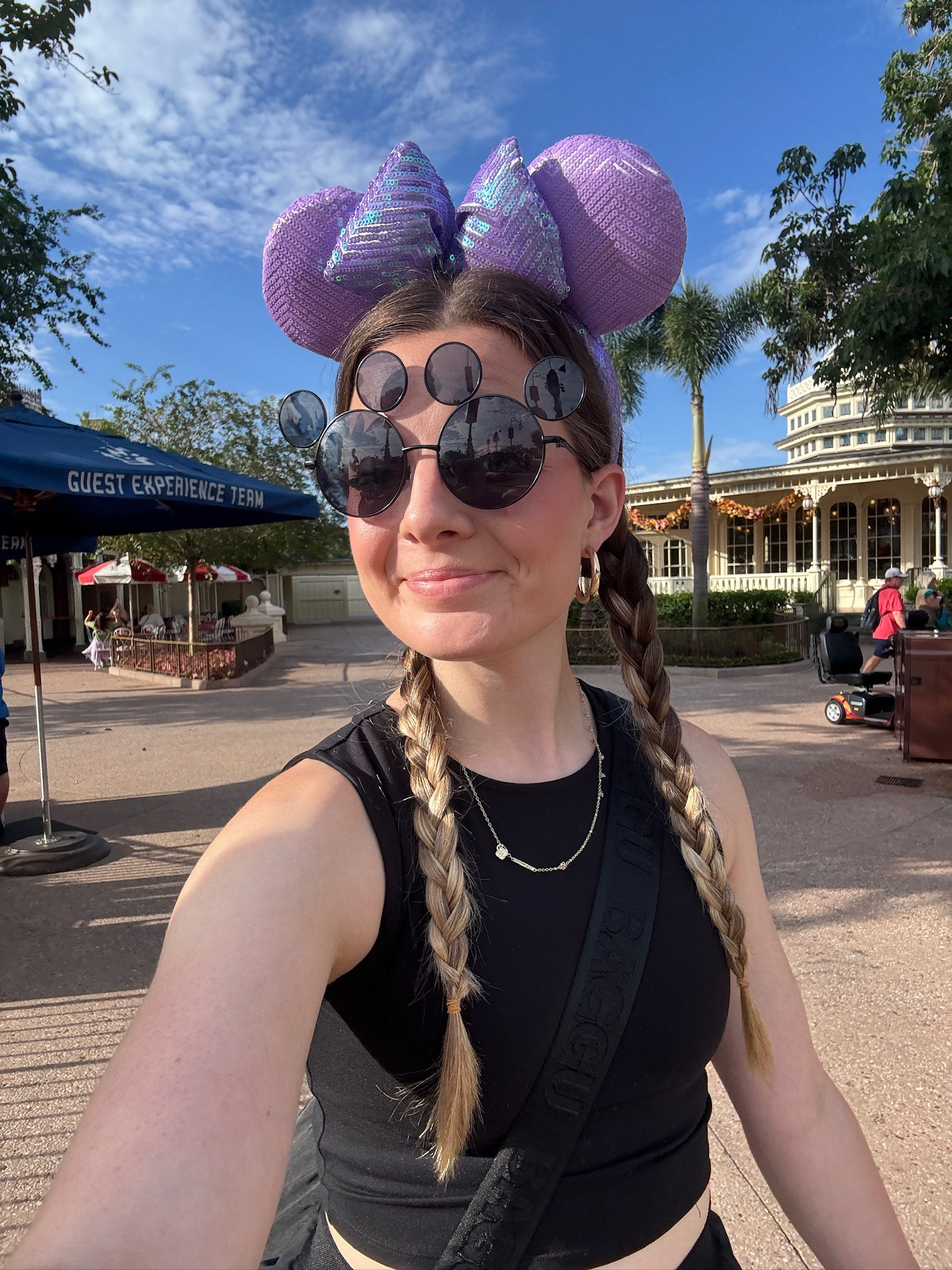 These purple iridescent sequin Minnie ears are absolutely STUNNING in person! The way they sparkle in the sun at the parks is unreal. I love pairing statement ears like these with a simple black outfit so the ears really shine. The classic Mickey sunglasses are a must-have Disney park essential - they're actually really comfortable and protect your eyes during those long park days. My braids hold up perfectly all day in the Florida humidity too!

#MinnieEars #DisneyEars #DisneyParkStyle #DisneyWorld #PurpleMinnieEars #SequinEars #DisneyParkOutfit #MickeyGlasses #DisneyAccessories 

 #LTKTravel