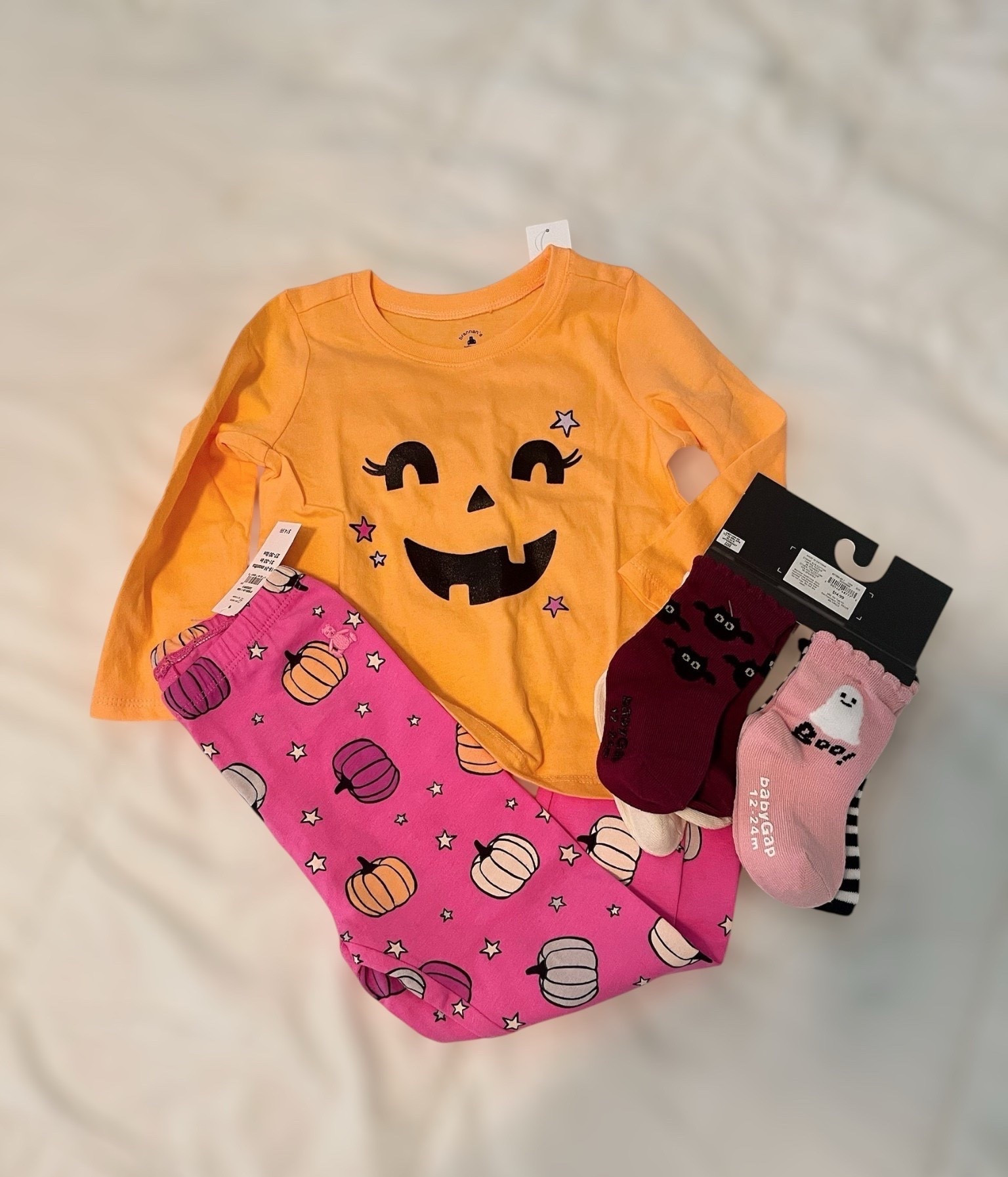 🎃 toddler Halloween cuteness overload! 👻🧡

This festive babyGap look from Gap Factory is too cute to spook and perfect for cozy fall fun! The Graphic T-Shirt in Icy Orange Pumpkin Halloween is a soft, long-sleeve tee featuring a sweet jack-o’-lantern face with lashes and stars. Paired it with the Pull-On Stretch Jersey Leggings in Pumpkin Pink, covered in pastel pumpkins and stars for a playful pop of color. Finished the look with the Halloween Crew Socks (4-Pack) featuring striped, bat, moon, and “Boo!” ghost designs—fun mix-and-match options all season long! 🧦✨

🛍️ Everything’s on major sale:
	•	T-Shirt: $6 (originally $14.99 – 60% off)
	•	Leggings: $6 (originally $14.99 – 60% off)
	•	Socks: $11.99 (originally $14.99 – 20% off)

🎁 Great picks for Halloween pajama parties, school spirit days, or comfy October playwear!

#LTKSaleAlert #LTKKids #LTKBaby

#LTKBaby #LTKFindsUnder50 #LTKKids