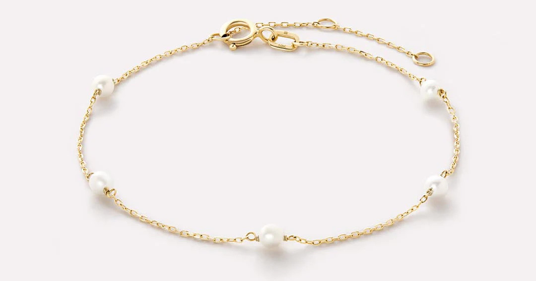An elevated essential, this gold pearl bracelet crafted with waterproof solid gold features sleek... | Ana Luisa