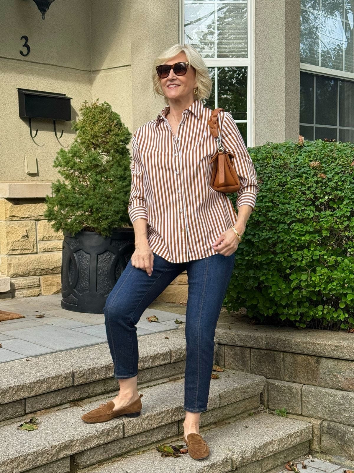 Some outfits really don’t need much to look good — and this is one of them. 🤎

I love the classic combination of a white and camel striped shirt with cropped denim and loafers. It feels polished but still relaxed, and the camel adds just enough warmth to keep the look from feeling too basic.

This is the kind of outfit I could throw on for lunch, errands, or a casual day out and feel instantly put together. Simple, comfortable, and timeless — I’ll take that every time!

#LTKSeasonal #LTKOver40 #LTKgrwm