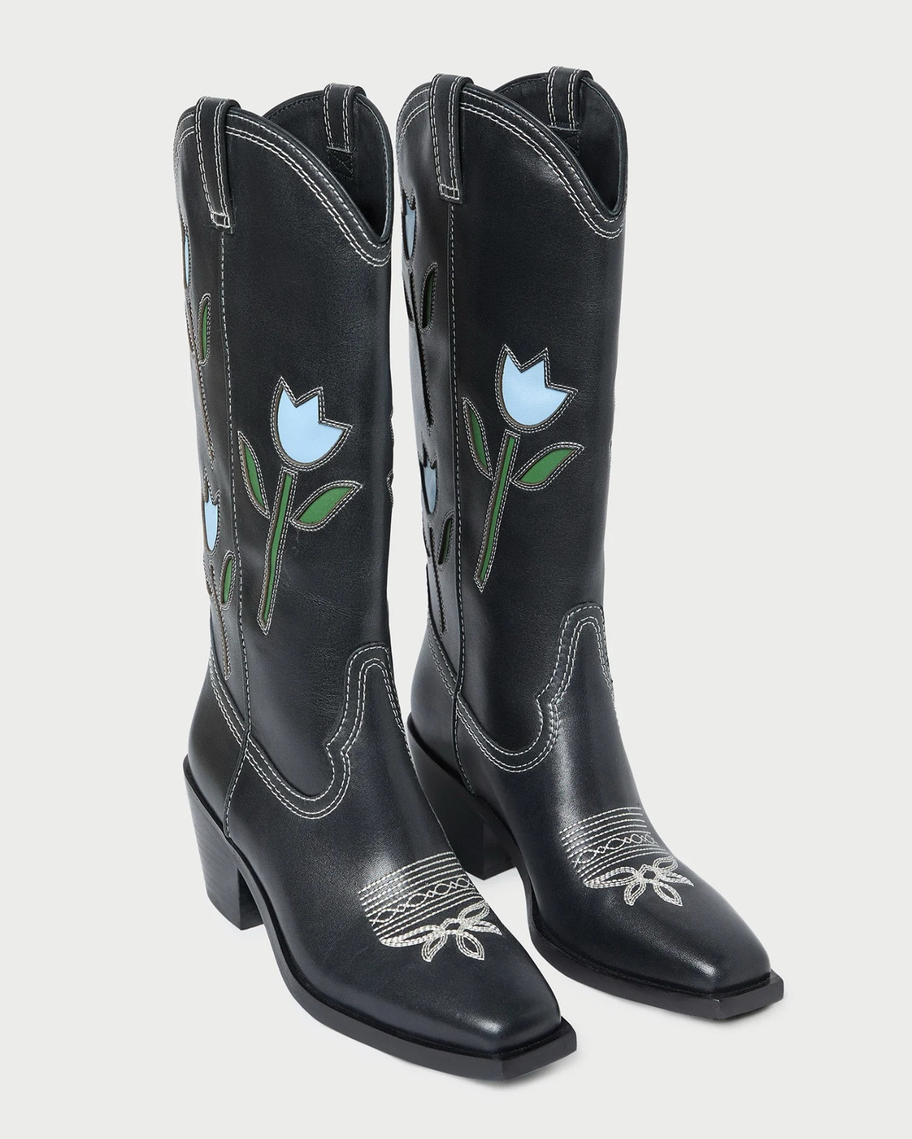 I did not even know Loeffler Randall made cowgirl boots, but these are beautiful! I think I would go for the black and blue tulips. Which color do you prefer?  