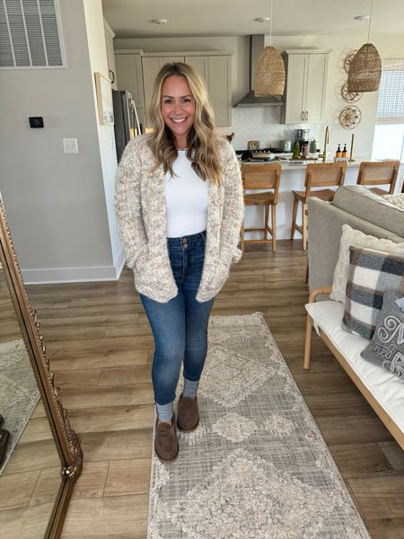 Comfortable and cute are two words to describe this outfit. I paired a shimmery sweater cardigan with a white body suit and denim skinny jeans from Maurices. I’m wearing a Large in all tops and a 10 in pants. 

#LTKfindsunder100 #LTKstyletip #LTKmidsize