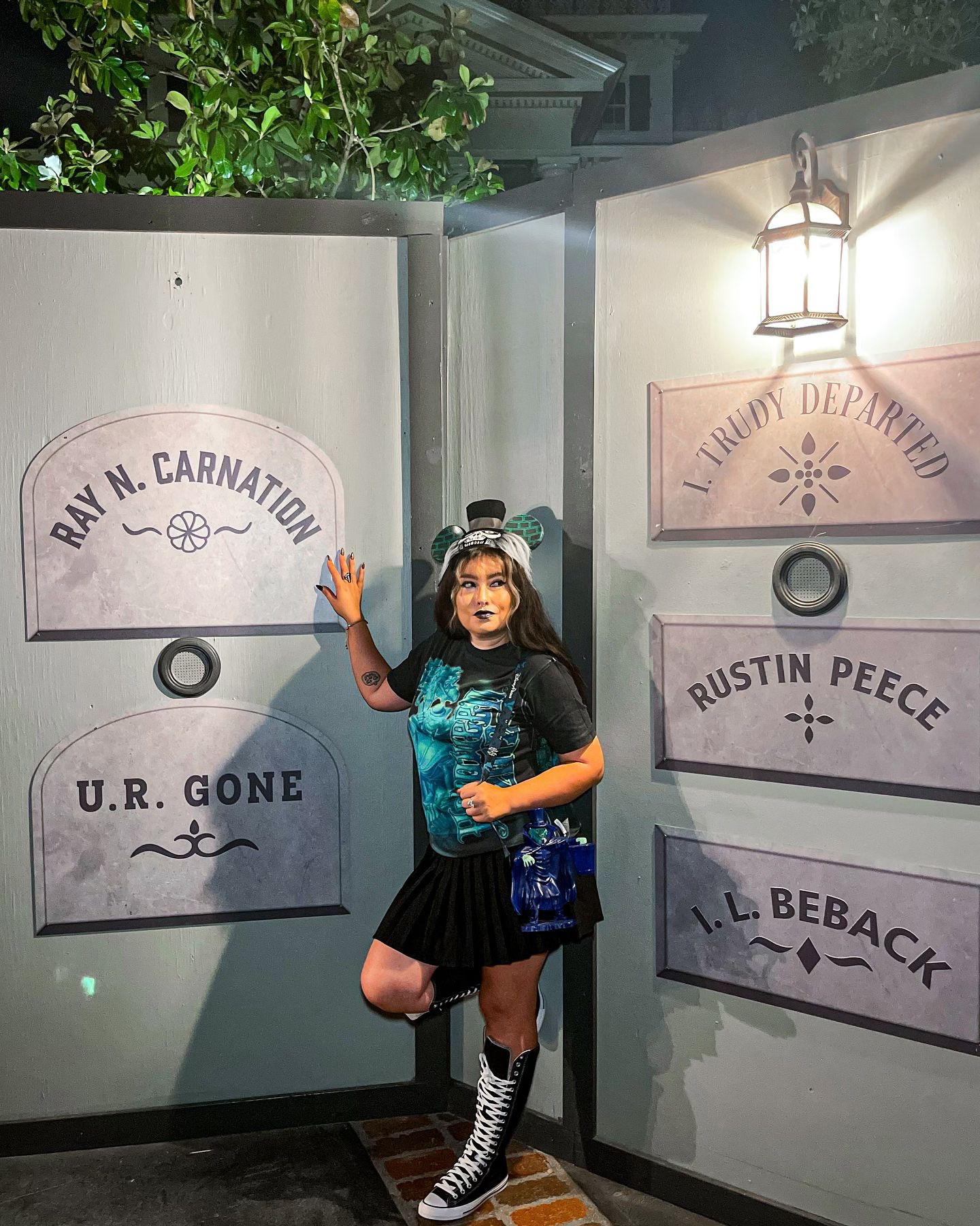 Patiently waiting for the Grim grinning ghosts to come back out to socialize because today marks the official 100 days until Halloween! 🪦⚰️🕸️👻🏛️ *Honorary ghoul * 
🖤Fit Deets🖤
Shirt + Hatbox Ghost ear hat @ebay 
Skirt + chain belt @amazoninfluencerprogram 
Shoes Sky high @converse 
Fanny pack + Hatbox sipper @disneyparks
..
..
.. #100daysuntilhalloween 
#hauntedmansion #hatboxghost #ghouls #ghoulish #honoraryghoul #neworleanssquaredisneyland #disneyland #999ghosts #spooky #spookyseason #disneystyle #disneyfashion #disneyalternative #altstyle #altfashion #altdisney #disneybound #thedisneybound #hitchhikingghosts #spookyseason #disneyupdates #madameleota