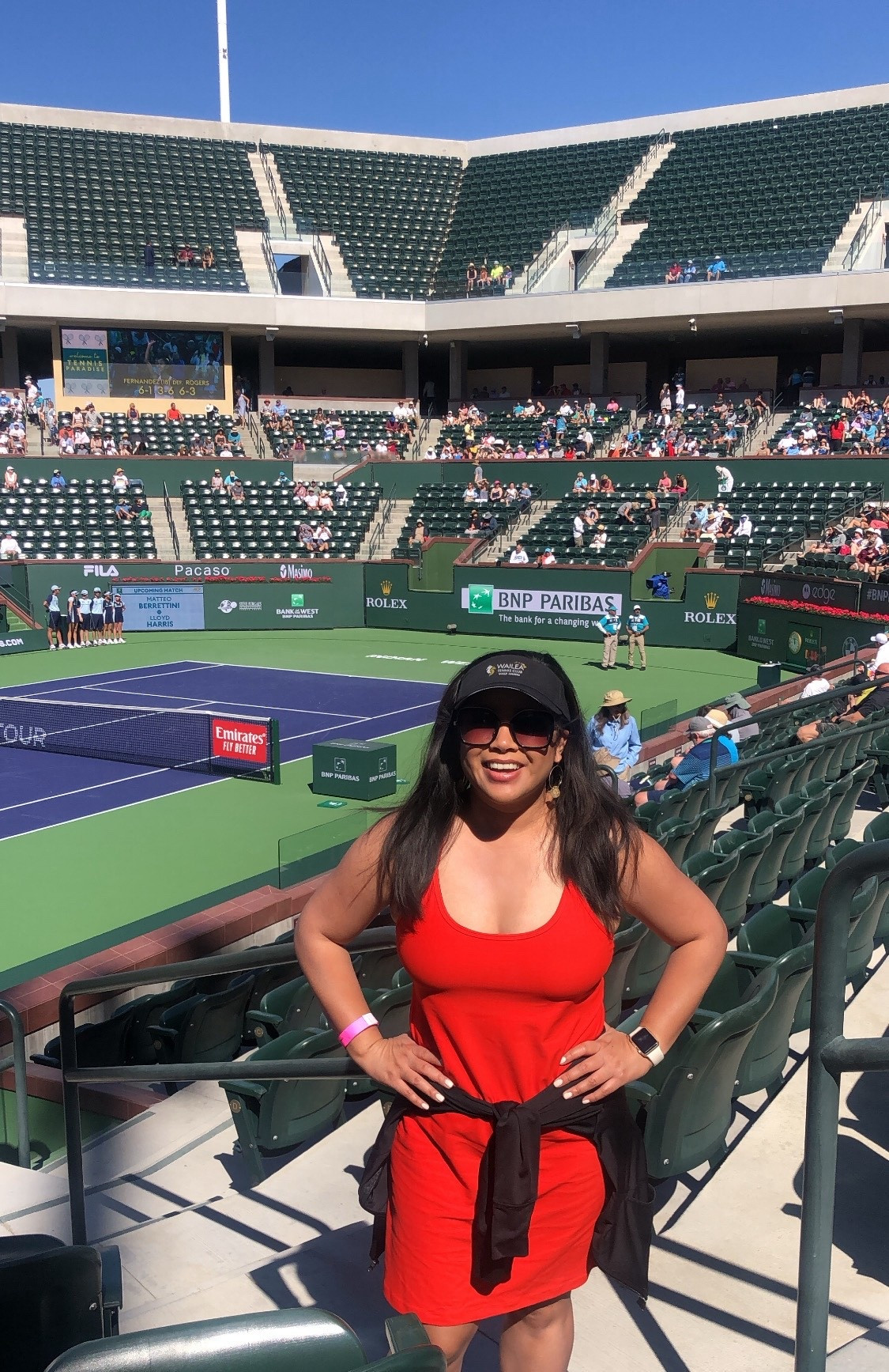 What to Wear to BNP Paribas Open Tennis

One of my favorite parts of going to the BNP Paribas Open is leaning into tennis style for the day. Sporty, polished, and comfortable for walking around the grounds.

I wore a red athleisure tennis dress with a visor that I brought home from Wailea Tennis Club in Hawaii. I love wearing pieces like this to events because they hold memories. It is a small way to bring another place you have loved into a new experience. It also lets you be the brand for the day rather than feeling like you have to buy something new just for the event.

Tennis dresses are perfect for Indian Wells because they are lightweight for the warm daytime sun but still feel put together. Add a visor, comfortable sneakers or platform sandals, and a small bag for sunscreen, sunglasses, and your phone while you move between matches.

If you are heading to the BNP Paribas Open, think classic tennis style. A dress, a visor or hat, and something comfortable for a full day of sunshine and tennis.

#bnpparibasopen #indianwellstennis #tennisstyle #tennisoutfit #tennisdress #athleisuredress #tennisfashion #sportystyle #tennisspectatorstyle #deserttennis #tenniscore #whattowear #sportychic #tenniseventstyle

bnpparibas open outfit | indian wells tennis outfit | tennis spectator outfit | what to wear to indian wells tennis | tennis dress outfit | tennis fashion women | sporty chic tennis outfit | athleisure dress outfit | tennis event style | tenniscore fashion | desert tennis style | tennis tournament outfit

#LTKootd #LTKActive #LTKdayinmylife