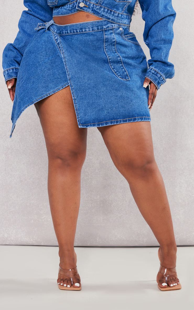 Plus Mid Blue Wash Wrap Denim Mini Skirt | PrettyLittleThing US