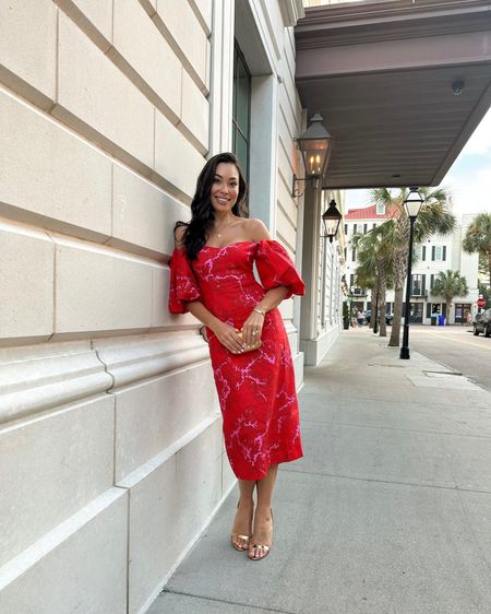 Kat Jamieson wears a red floral dress to a wedding welcome party. Rehearsal dinner, bridal, gold heels, cocktail party, formal attire, off the shoulder.

#LTKparties #LTKwedding #LTKHoliday