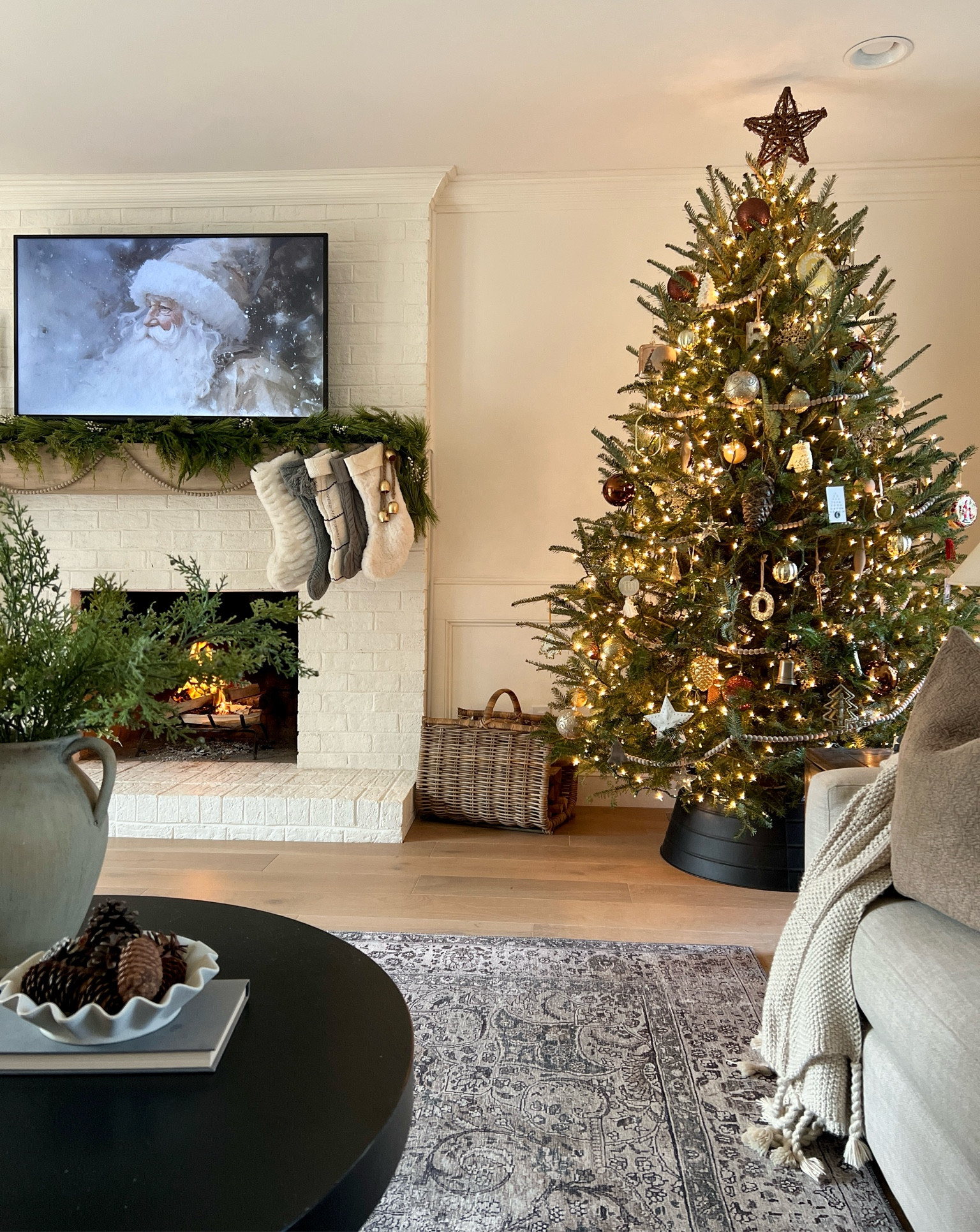 Christmas decor | living room Christmas decor | Christmas tree | Christmas mantel | Christmas art | Santa | loloi rug | living room rug | bedroom rug | Target | Michael’s | pottery barn | juniper berry stem | winter faux florals | winter stem | mantel decor | frame tv | Christmas art | vase | Christmas stockings | garland | affordable garland | Christmas tree collar 

#LTKhome #LTKHoliday #LTKSeasonal