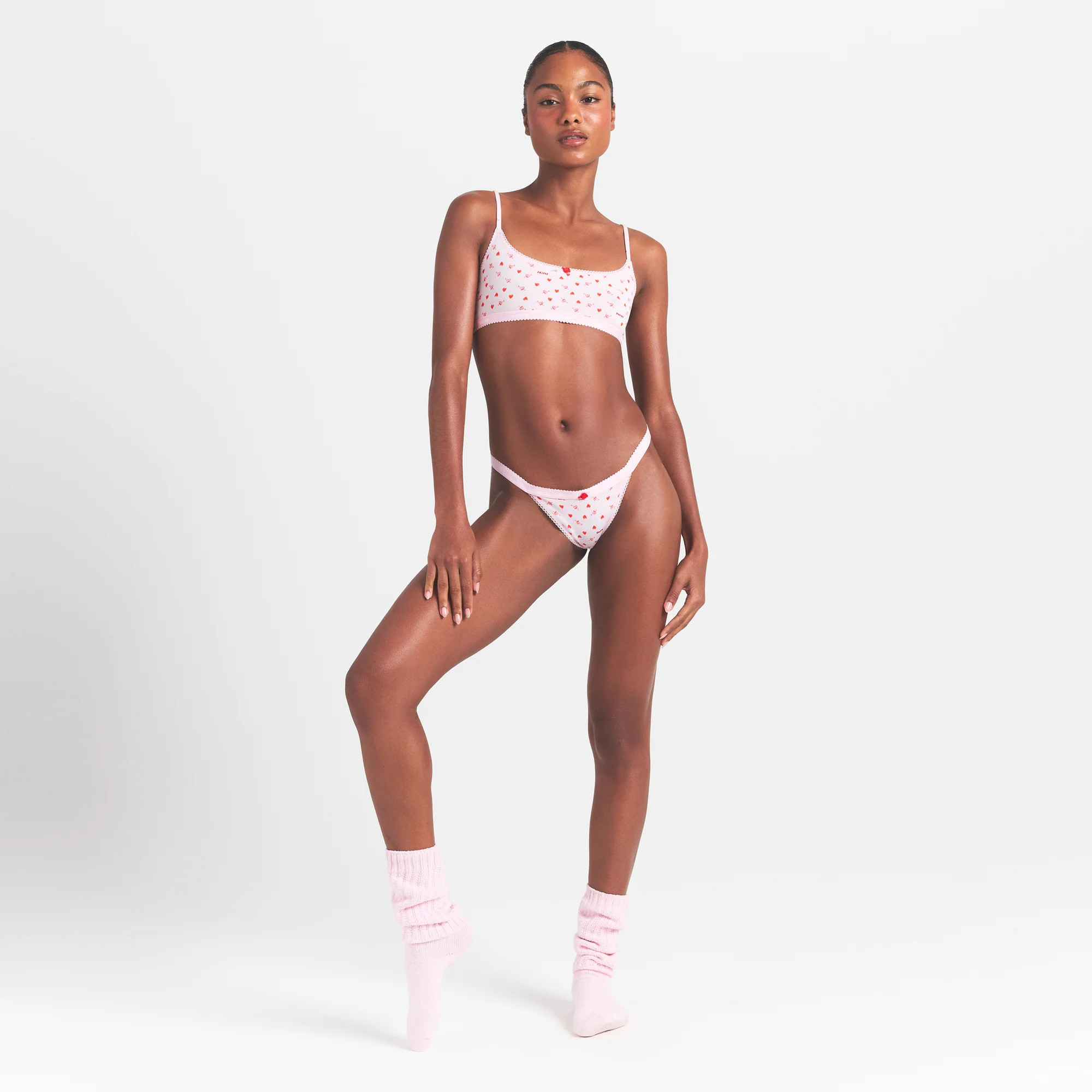 LIGHTWEIGHT COTTON LOGO PICOT SCOOP BRALETTE | BABY PINK ARROWED HEARTS | SKIMS | SKIMS (US)