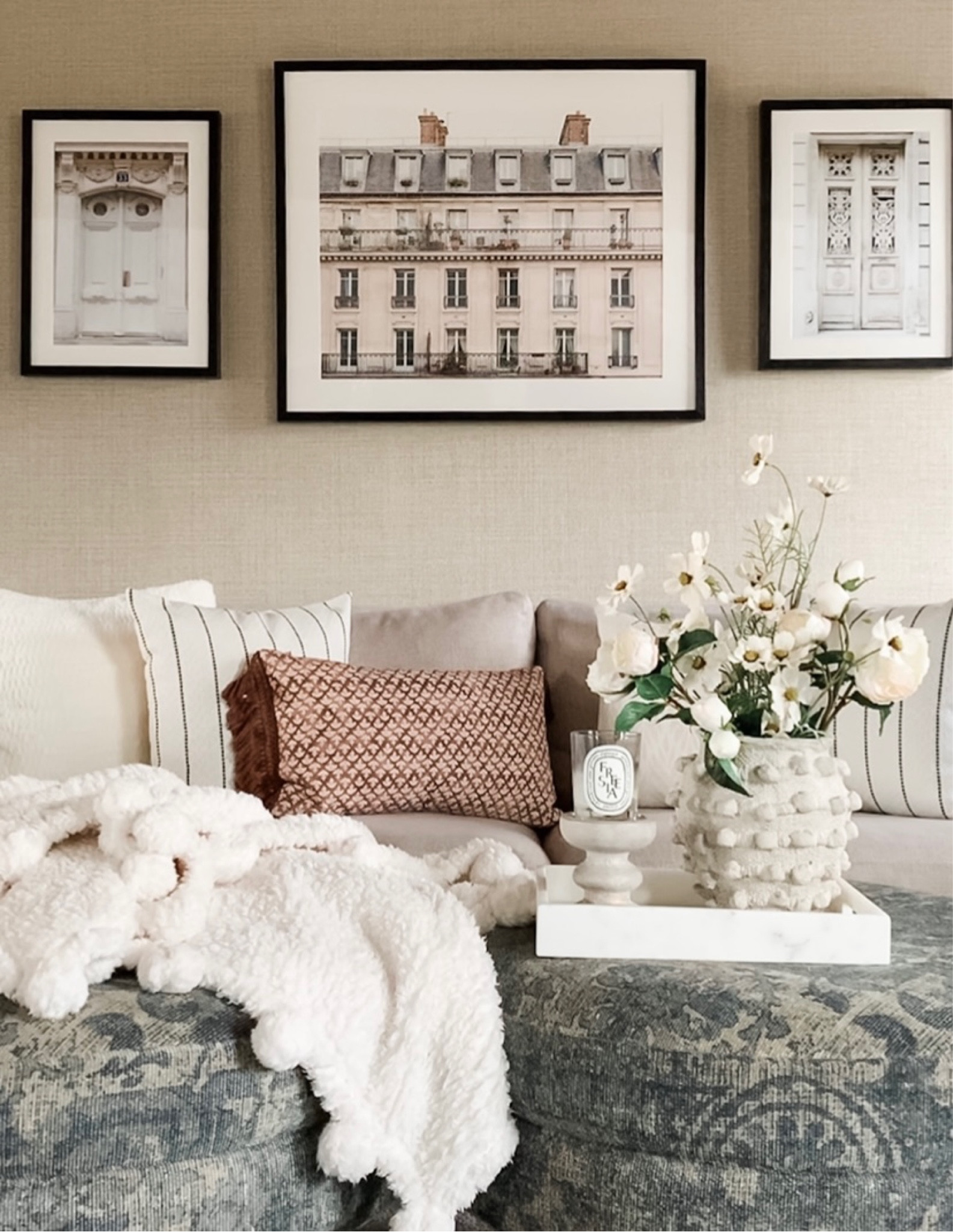 Living space styling, York sofa, new spring throw pillows in mauve, off white neutrals, white with black stripe, cozy and comfy white pom pom Sherpa throw blanket, artwork, Minka pot, vase, marble tray, cosmo faux flowers, Diptyque scented candle. Home decor accessories, interior styling, design. Target, minted, Anthropologie, Pottery Barn. Free shipping.

#LTKstyletip #LTKhome #LTKFind