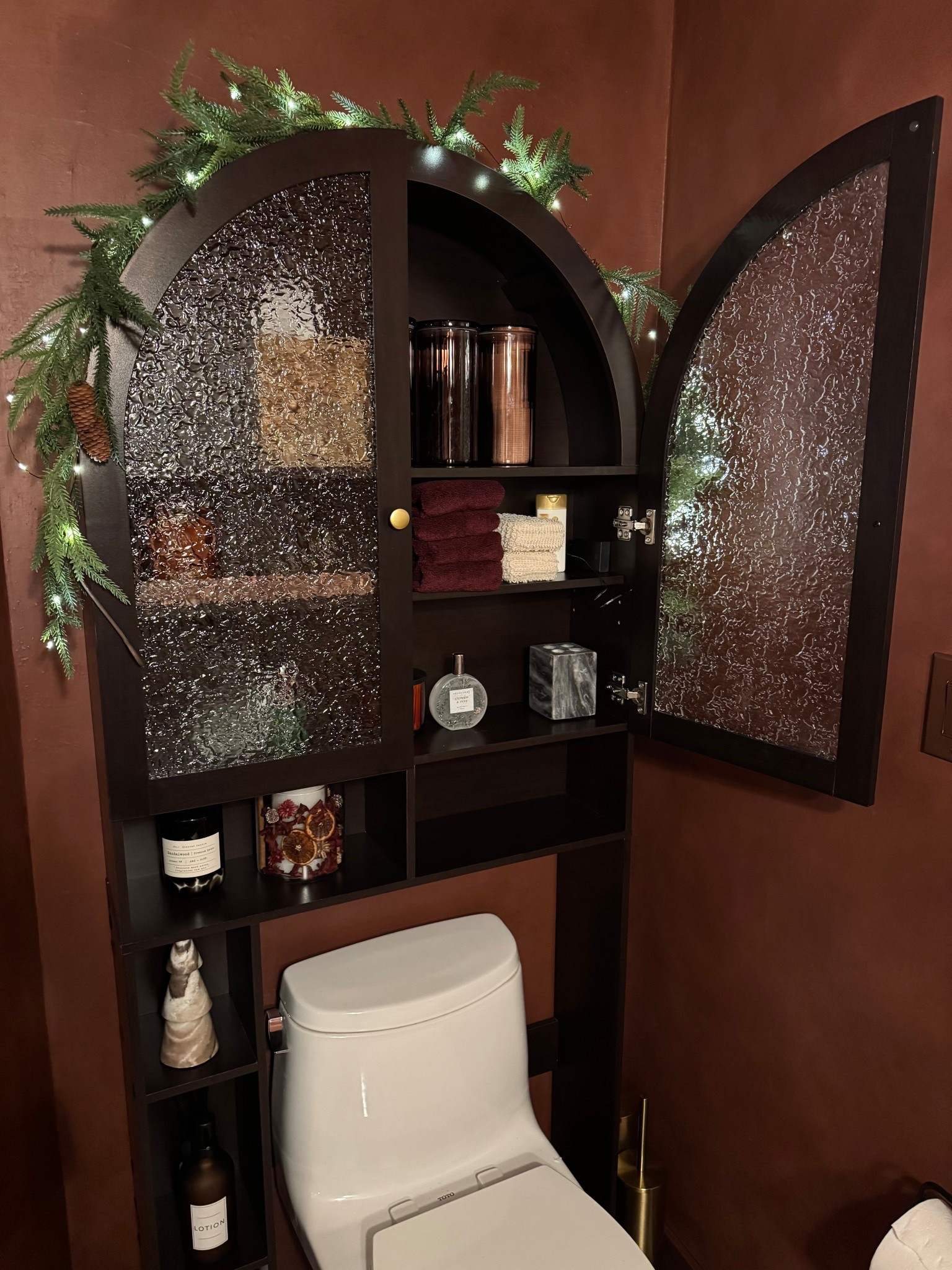 Sometimes over the toilet storage can look tacky, but I had no other place to put a cabinet. I found this one, and it’s actually so beautiful! It holds quite a bit and still looks elegant. I did order some different knobs for it, because I feel like the knobs it has are very cheap looking.

#LTKHoliday #LTKHome