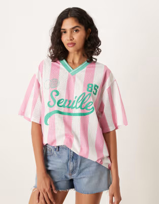 ASOS DESIGN oversized football t-shirt with seville graphic in pink and green | ASOS | ASOS (Global)