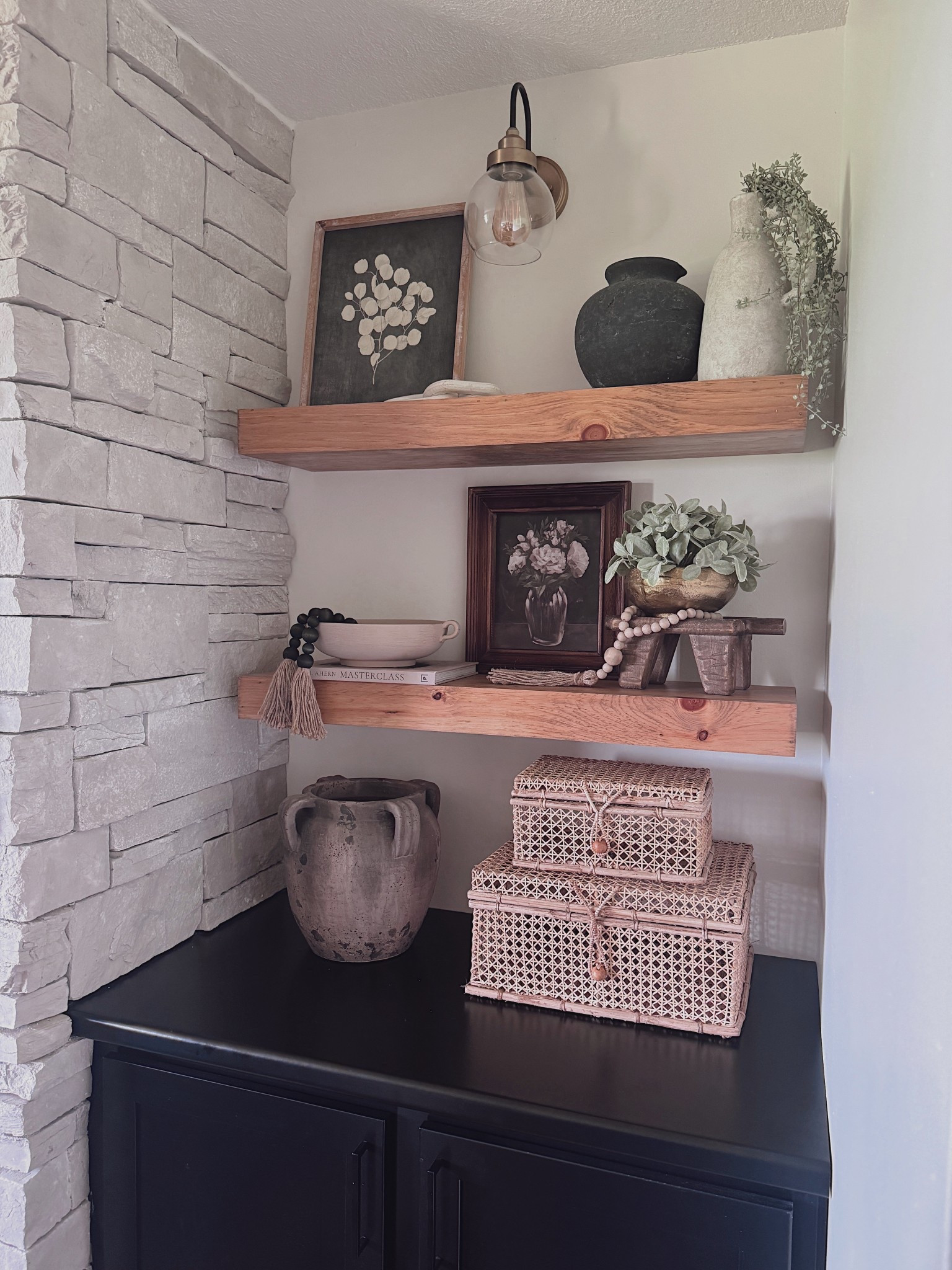 Neutral shelf styling perfection ✨ Mixing textures like stone, wood, pottery, and woven baskets creates such a cozy yet elevated look. These floating shelves are one of my favorite spots to style each season — perfect for layering art, greenery, and vintage-inspired finds. 🖤
Shop my exact shelf decor + similar pieces linked here!

#ShelfDecor #NeutralHome #ShelfStyling #HomeDecorInspo #NeutralDecor #LTKHome #FloatingShelves #RusticModern #NeutralShelfDecor #HomeStylingIdeas #LTKFinds #CozyHomeStyle