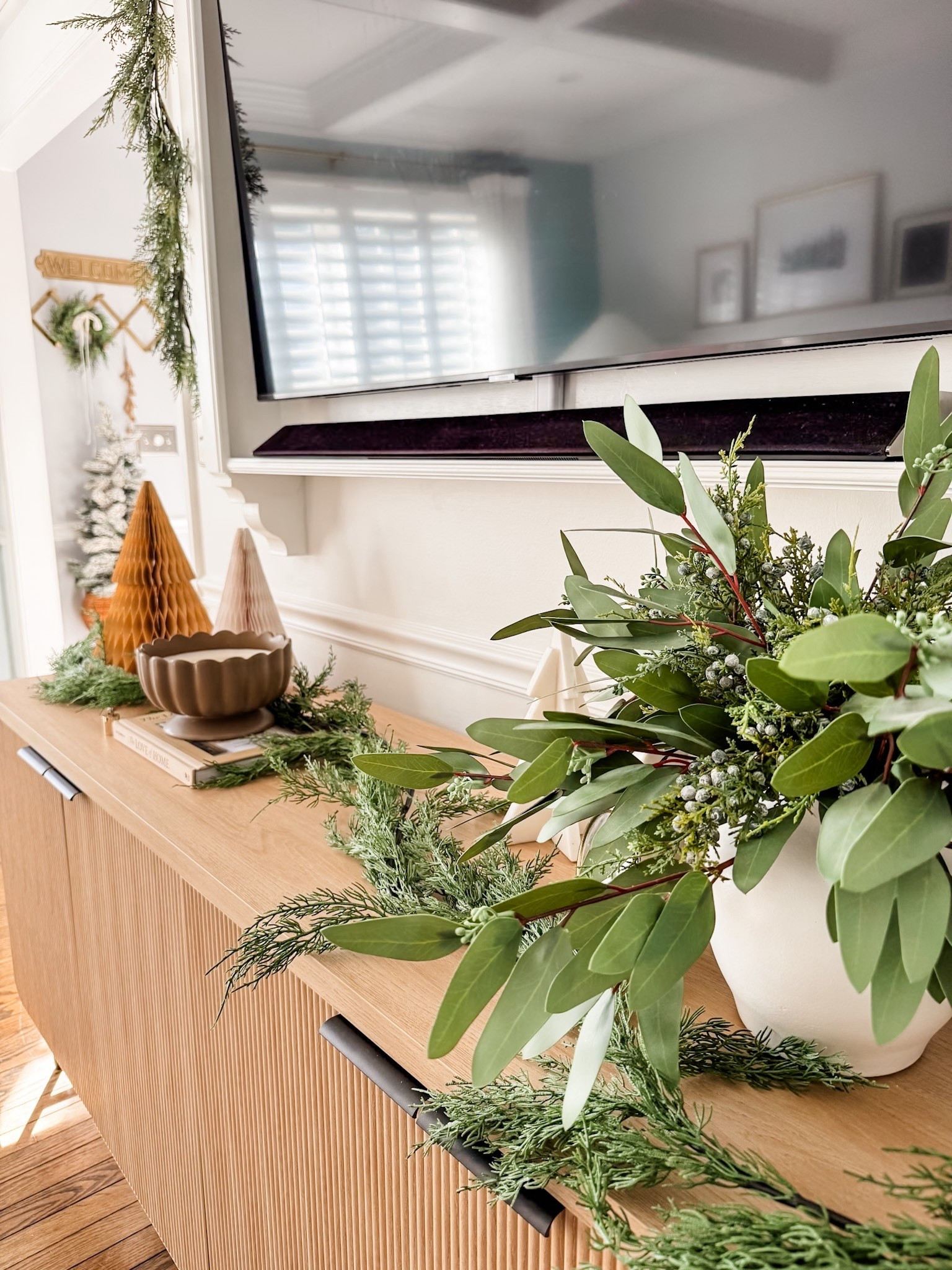 Christmas decor
Holiday decor
Console table
Fluted console table 
Table decor
Artificial eucalyptus stems
Cedar garland 
Scalloped candle 
Footed holiday candle
Paper tree decor
Coffee table book
Mini cedar wreath 
Holiday greenery
Honeycomb tree 
Gold candle snuffer 

#LTKHome #LTKHoliday #LTKSeasonal