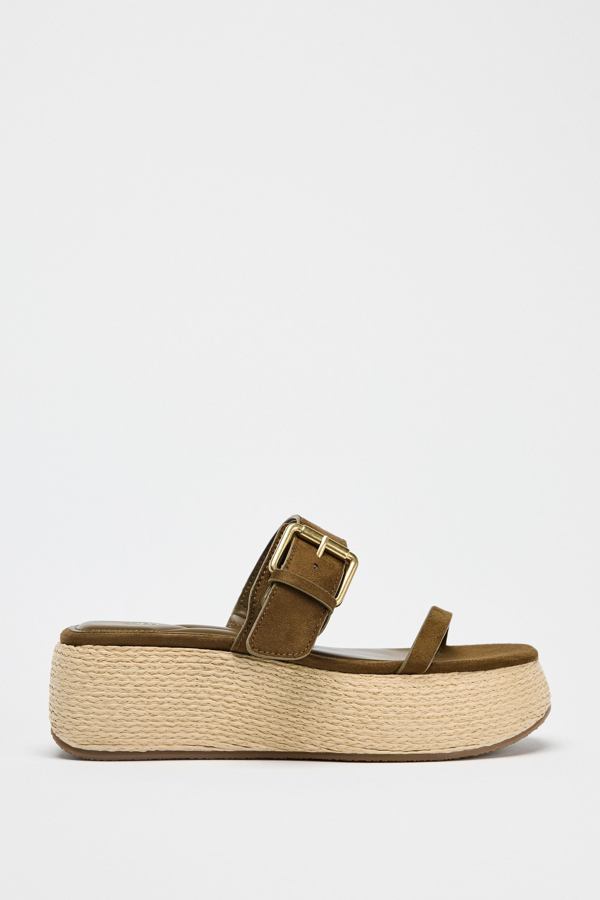 Platform sandals. Double strap at the front with metal buckle fastening. Sole with contrasting ra... | Zara US