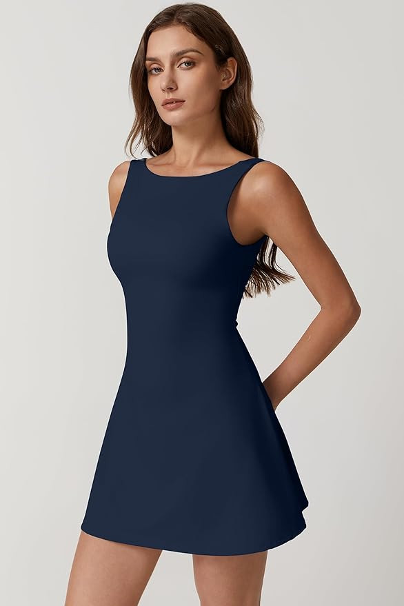 QINSEN Womens Open Back Tennis Dress Sleeveless Built in Shorts Golf Athletic Dress with Pockets | Amazon (US)