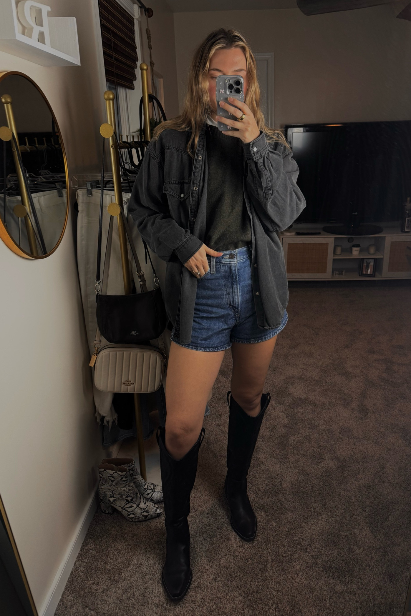 Ready for a bold winter look? ❄️ Start with a dark Levi’s denim button-up layered over a cozy dark cashmere sweater for that perfect mix of warmth and style. 🧣 Pair it with Levi’s 80’s baggy dad shorts for a throwback vibe that keeps it relaxed yet fashion-forward. Top it off with tall black cowboy boots for the ultimate blend of rugged charm and sophistication. 🤠 This outfit is perfect for those chilly days when you want to stay comfy but look effortlessly cool. Shop these pieces now and rock your winter look with confidence! 🛍️ #WinterLayers #LevisDenim #CashmereCozy #DadShorts #CowboyBoots #CasualChic #LTKFinds #BoldStyle #WinterFashion 

#LTKStyleTip #LTKShoeCrush #LTKSaleAlert