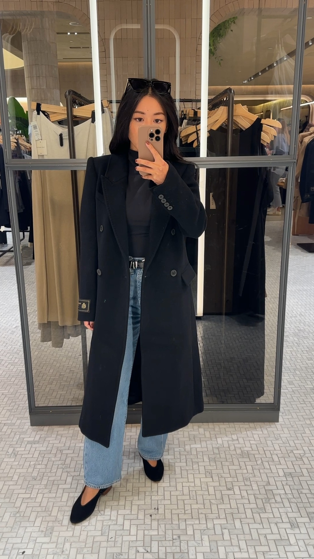 Trying on xxs in the Aritzia Constant coat in the thicker wool cashmere material. Same coat style  also comes in knee length (linked).

Runs big; size down if you can 

The Constant coat is one of their core styles that comes back each year in different materials and colors. I’ve found that depending on how thick the material is, the coat will fit a little bit differently! 

The wool cashmere is a thicker, plush feeling material that is heavier weight than their regular wool material. In this material the coat feels a little big and long on a petite frame, but is extra warm if you like an oversized maxi coat look. The merino or lighter weight wool Constant coats feel less thick and slimmer fit. 

• Levi’s Ribcage jeans 24 x 27 in “in the middle” wash - some of my favorite Levi’s, I own in several washes. High rise and great to pair with flats, heels, or sneakers! 

• Black mockneck Xs , soft modal blend. I sized up. 

• Madewell belt xxs 

• Sezane flats 35 with heel lift added so my ankles don’t rub

Black winter wool coat, chic fall outfit ideas 

#LTKTravel #LTKHoliday #LTKSeasonal