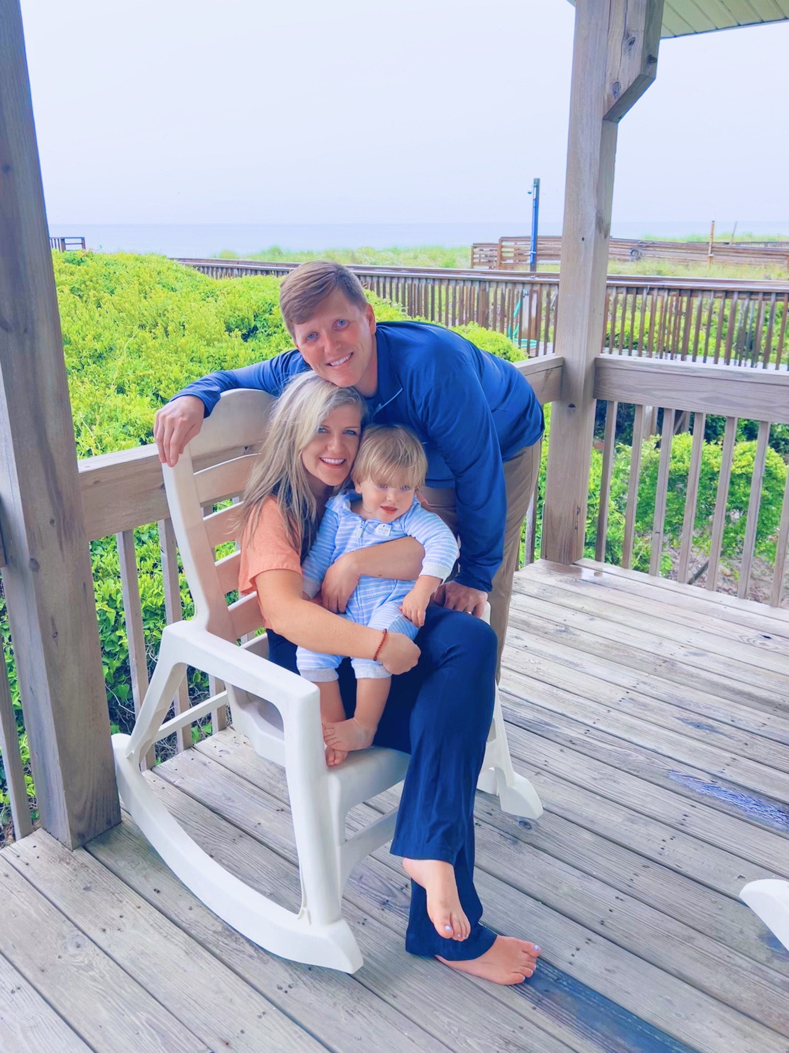 no place we’d rather spend this little cutie’s “birthday eve” than down at the beach - front porch rockin’ in the breeze 🌊🌾 the very  best! happy birthday 
eve, sweet baby Judson!! 👼🏼🩵