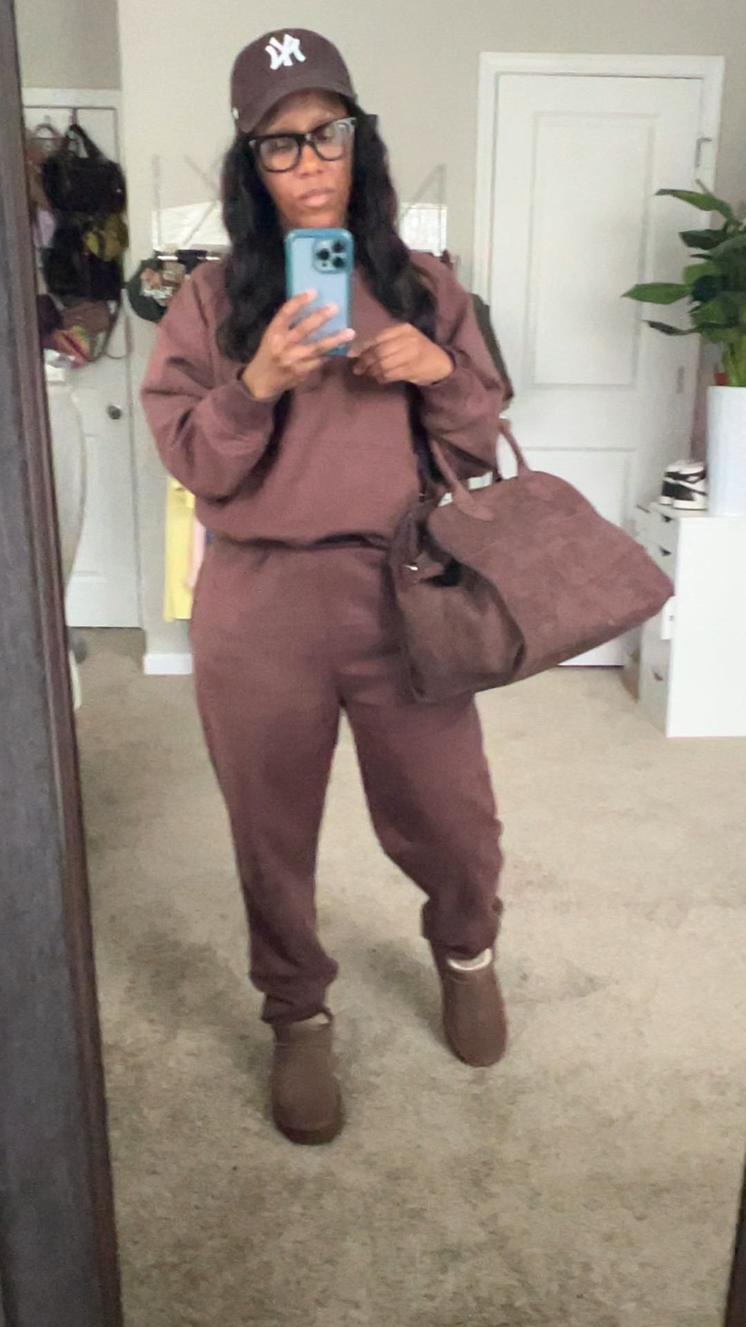 Monochromatic outfit idea. Brown hoodie and matching jogger pants, brown baseball hat, brown satchel bag, and brown ankle boots

#LTKOver40 #LTKFindsUnder50 #LTKootd