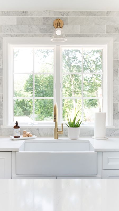 Beautiful bright white coastal style kitchen with brass fixtures, white cabinets

#LTKfamily #LTKhome